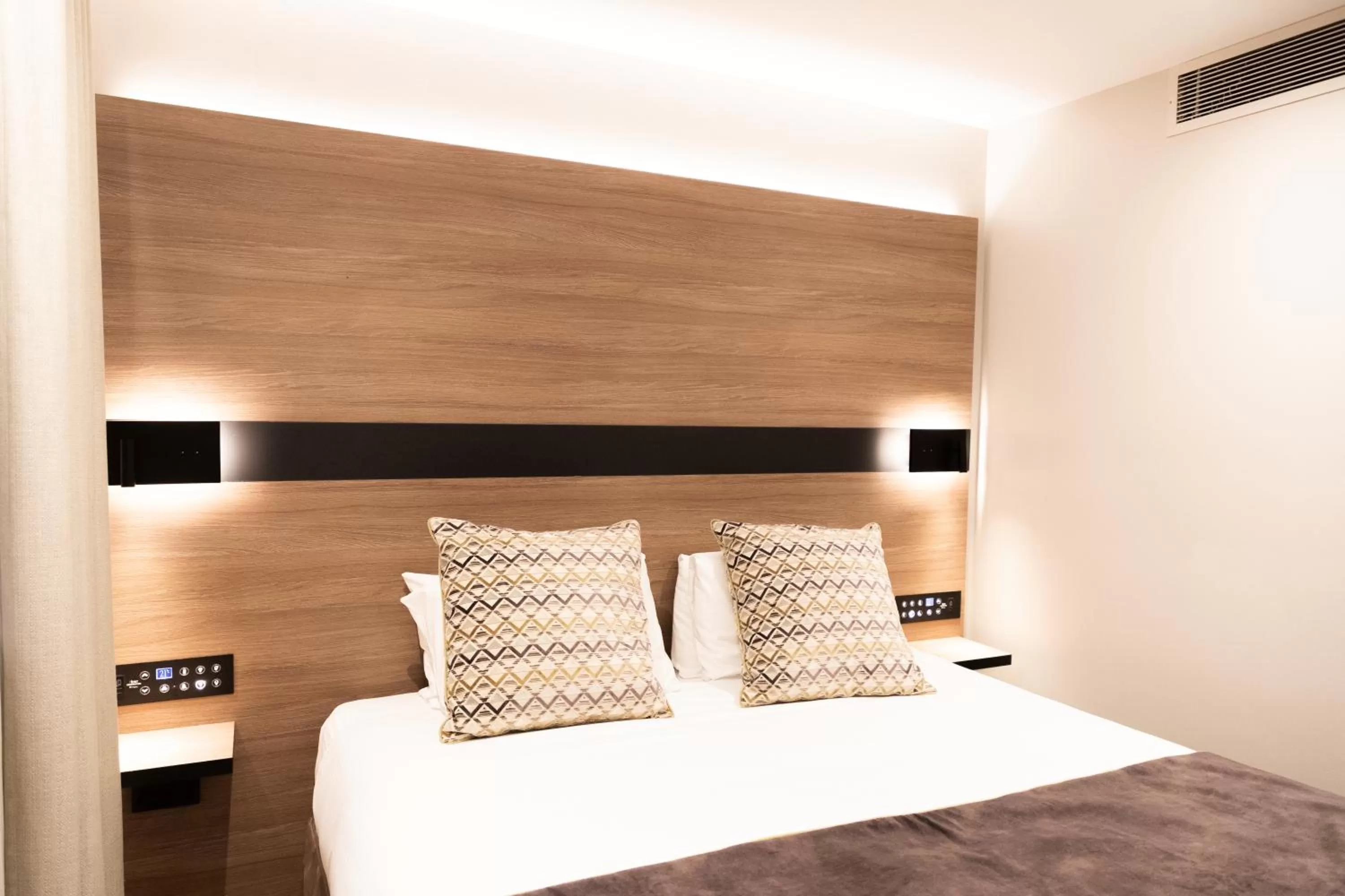 Bed in Merit Kensington Hotel