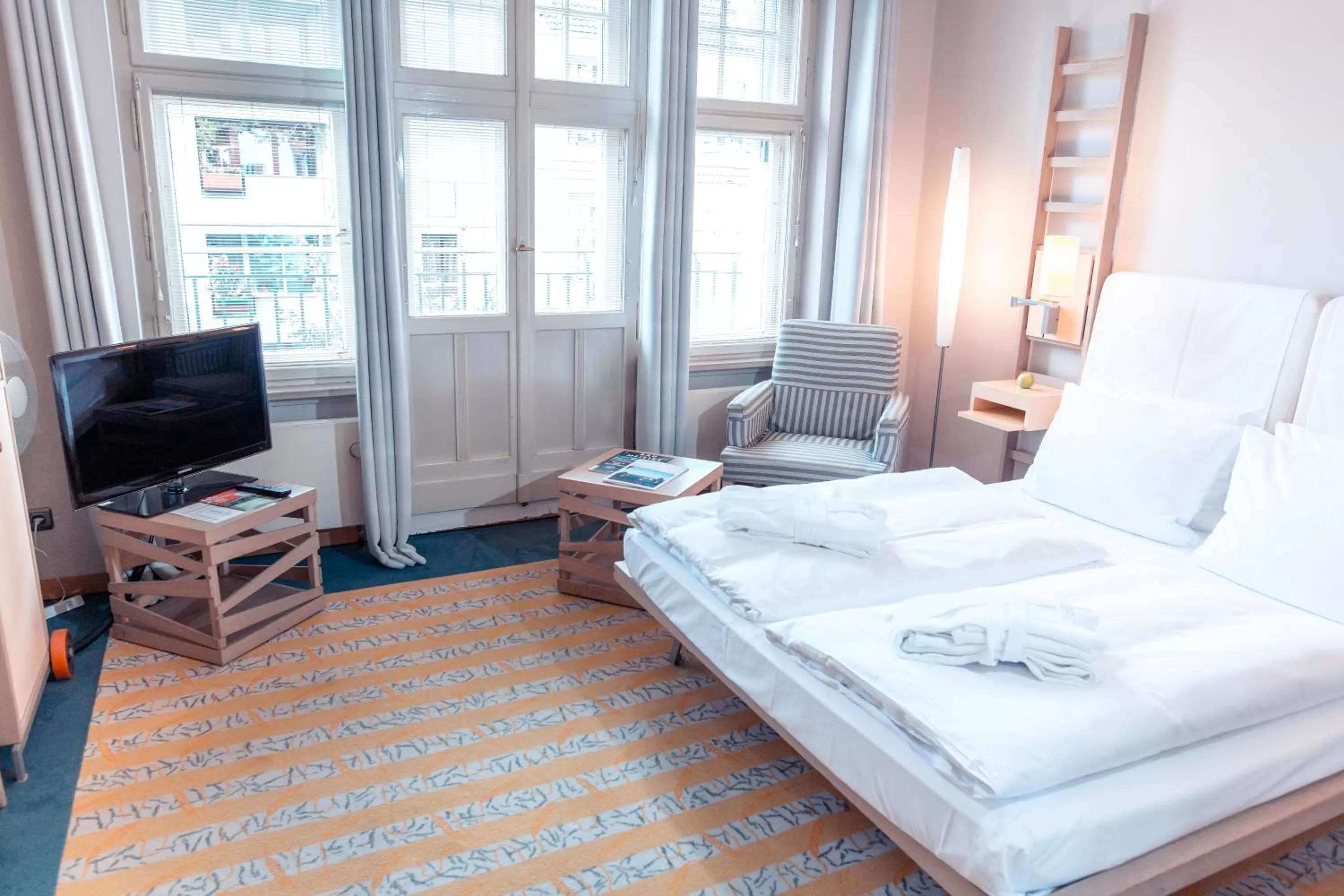 Bed in Hotel Bleibtreu Berlin by Golden Tulip