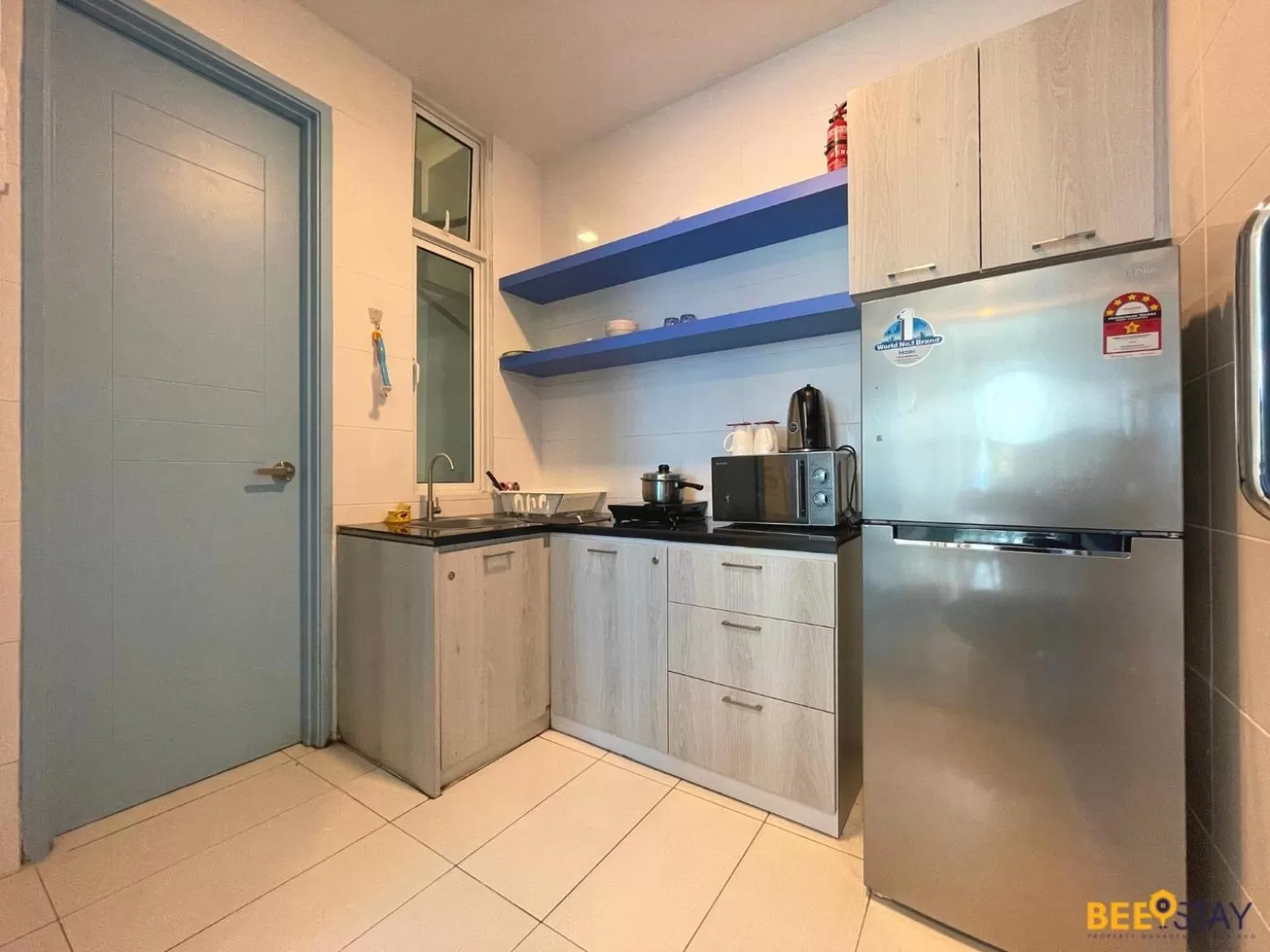 Kitchen/Kitchenette in The Wave Suites Melaka by BEESTAY