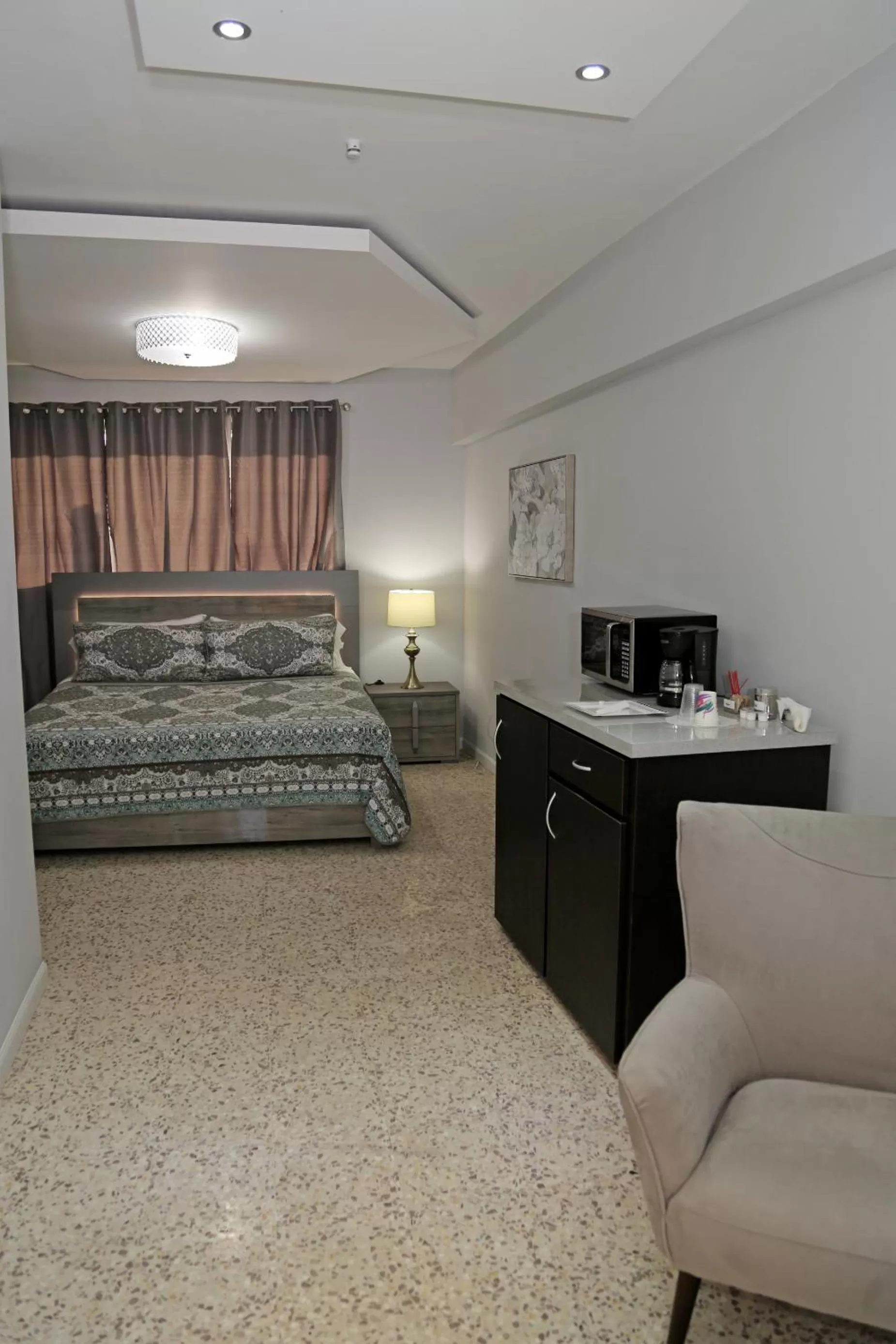 Bed in Itza-Bella Suites