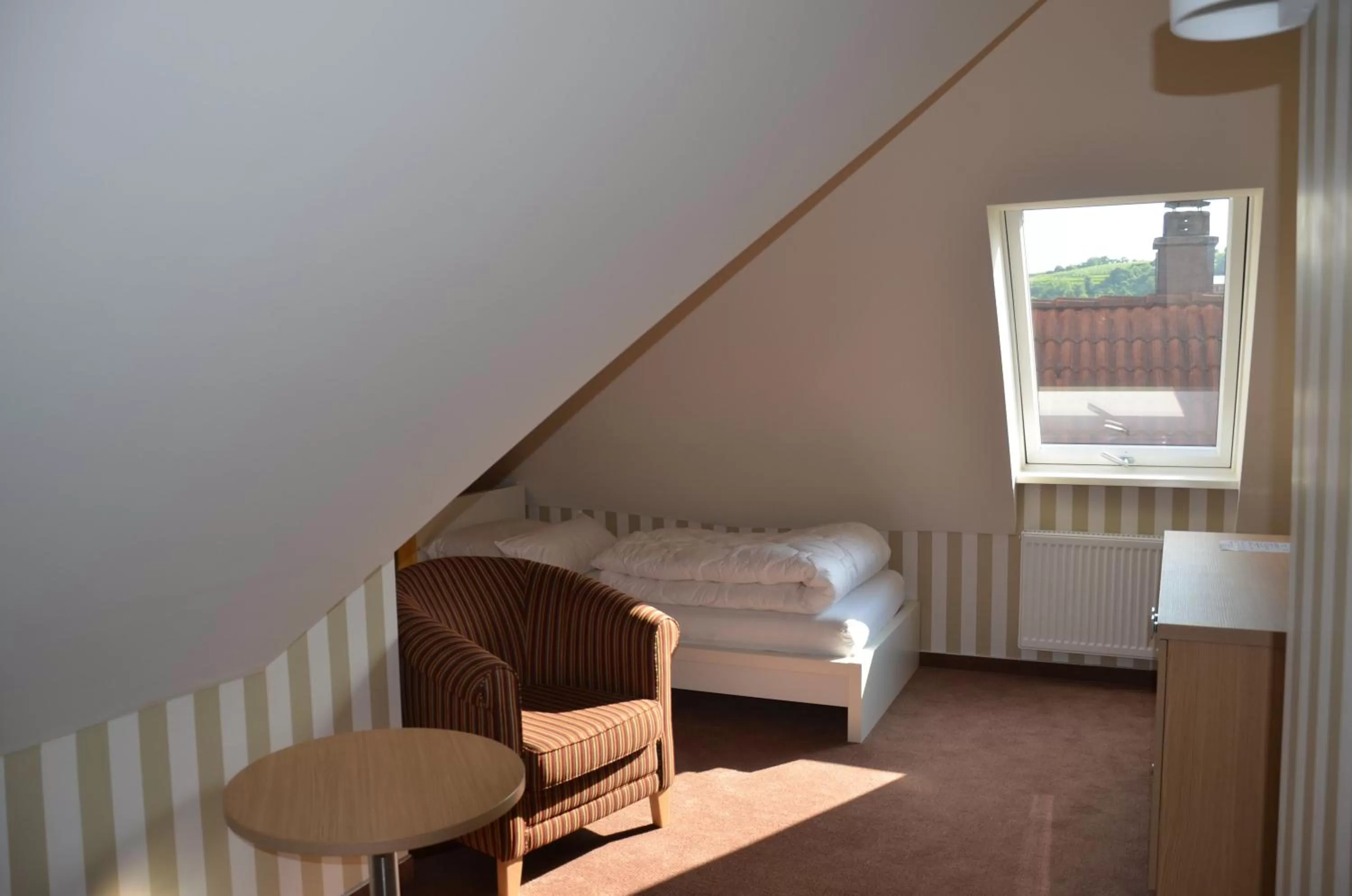 Bed, Seating Area in Hotel Ortel