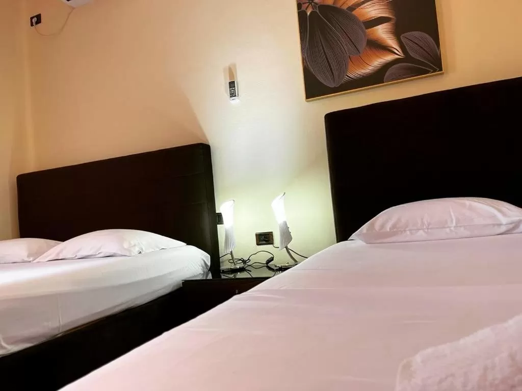 Bed in Hotel Ambasador Garden