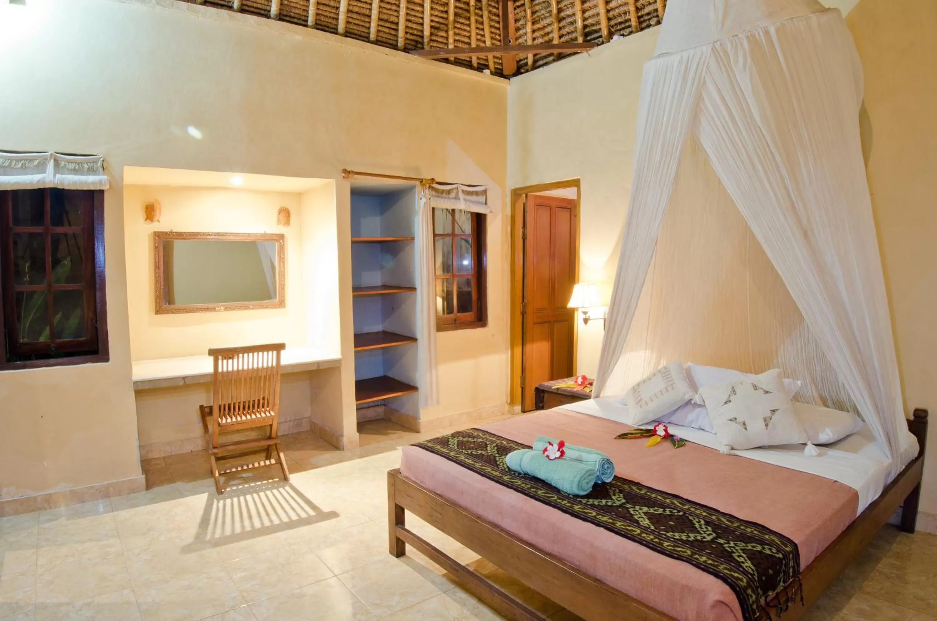 Bed in Mushroom Beach Bungalows