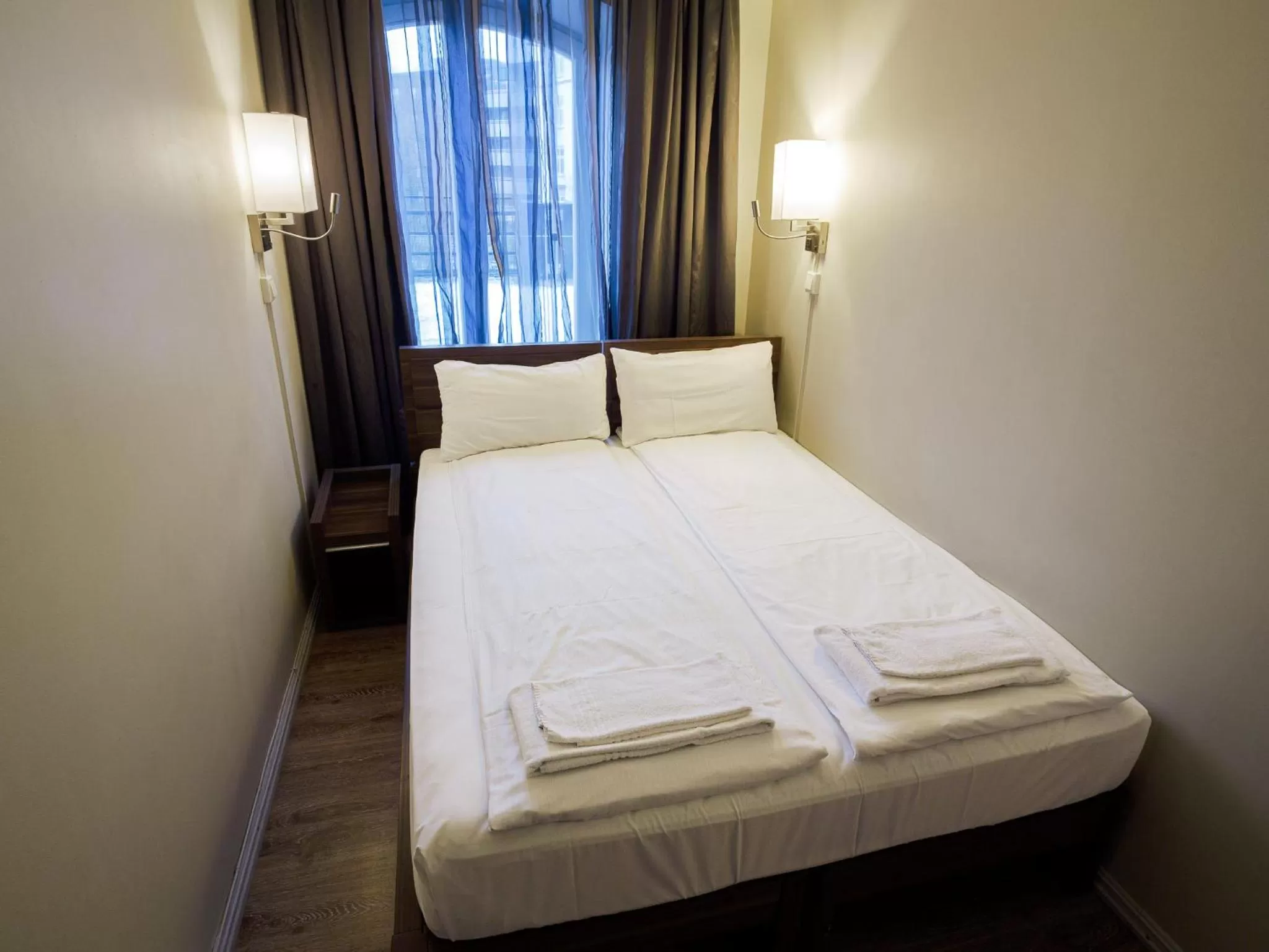 Bed in Central City Apartments