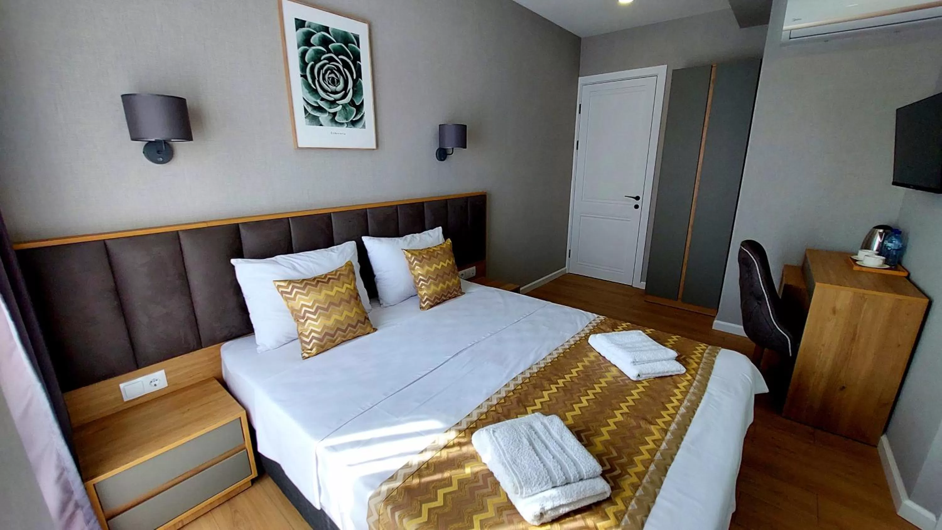 Bed in Falcon Boutique Hotel