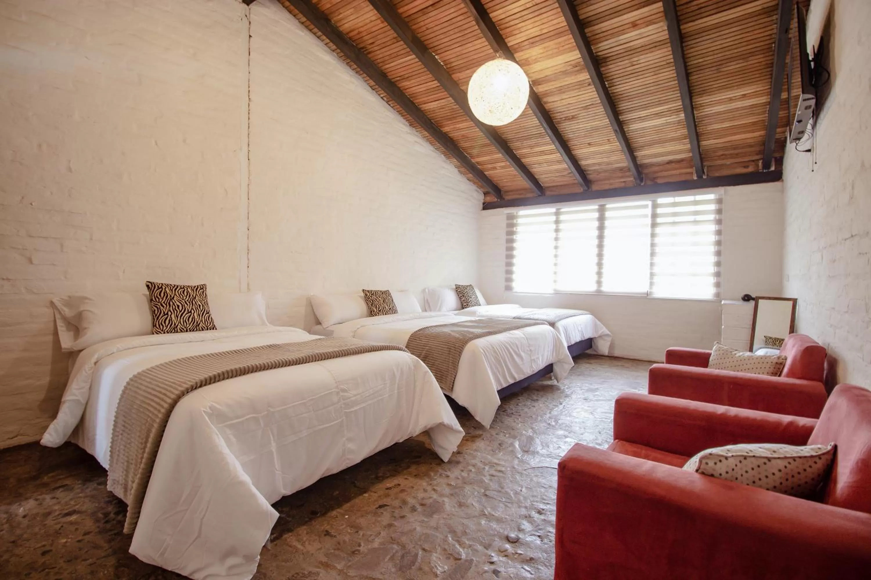 Bed in Rústic Hotel Quinta La Aurora