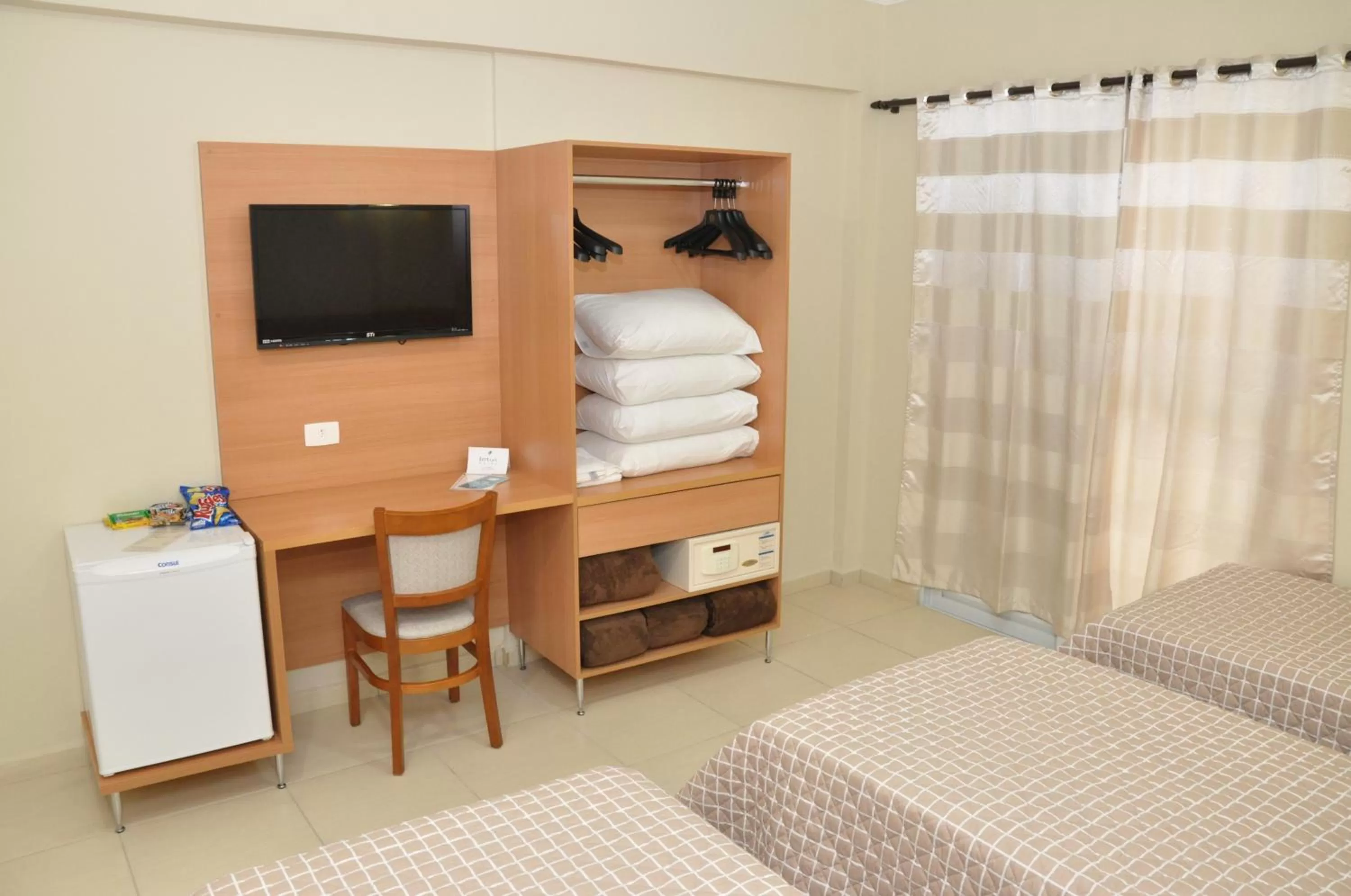 Bedroom, Bed in Lotus Hotel - à 6 km do Santuário de Aparecida-SP