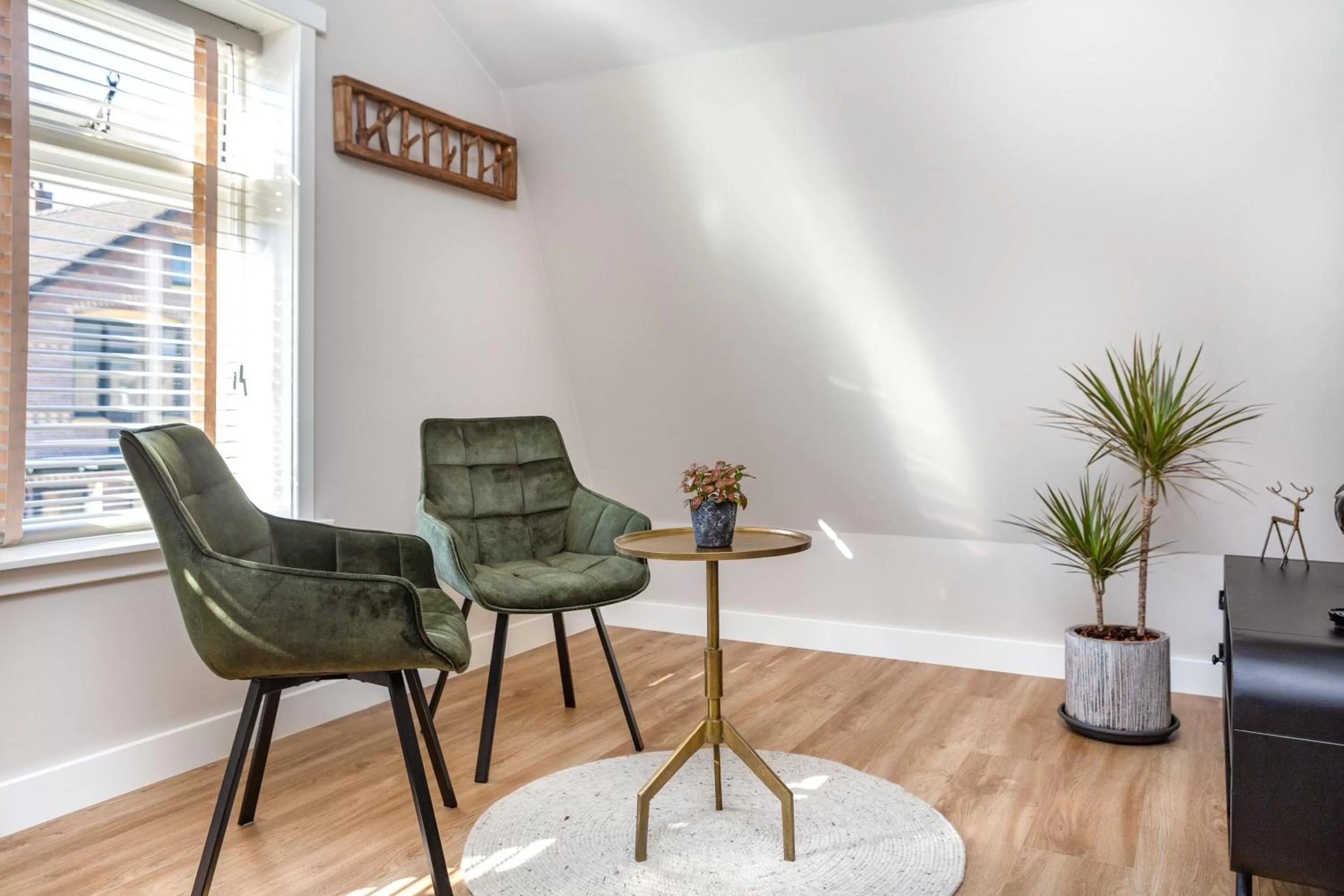 Seating area in B&B De Mansarde