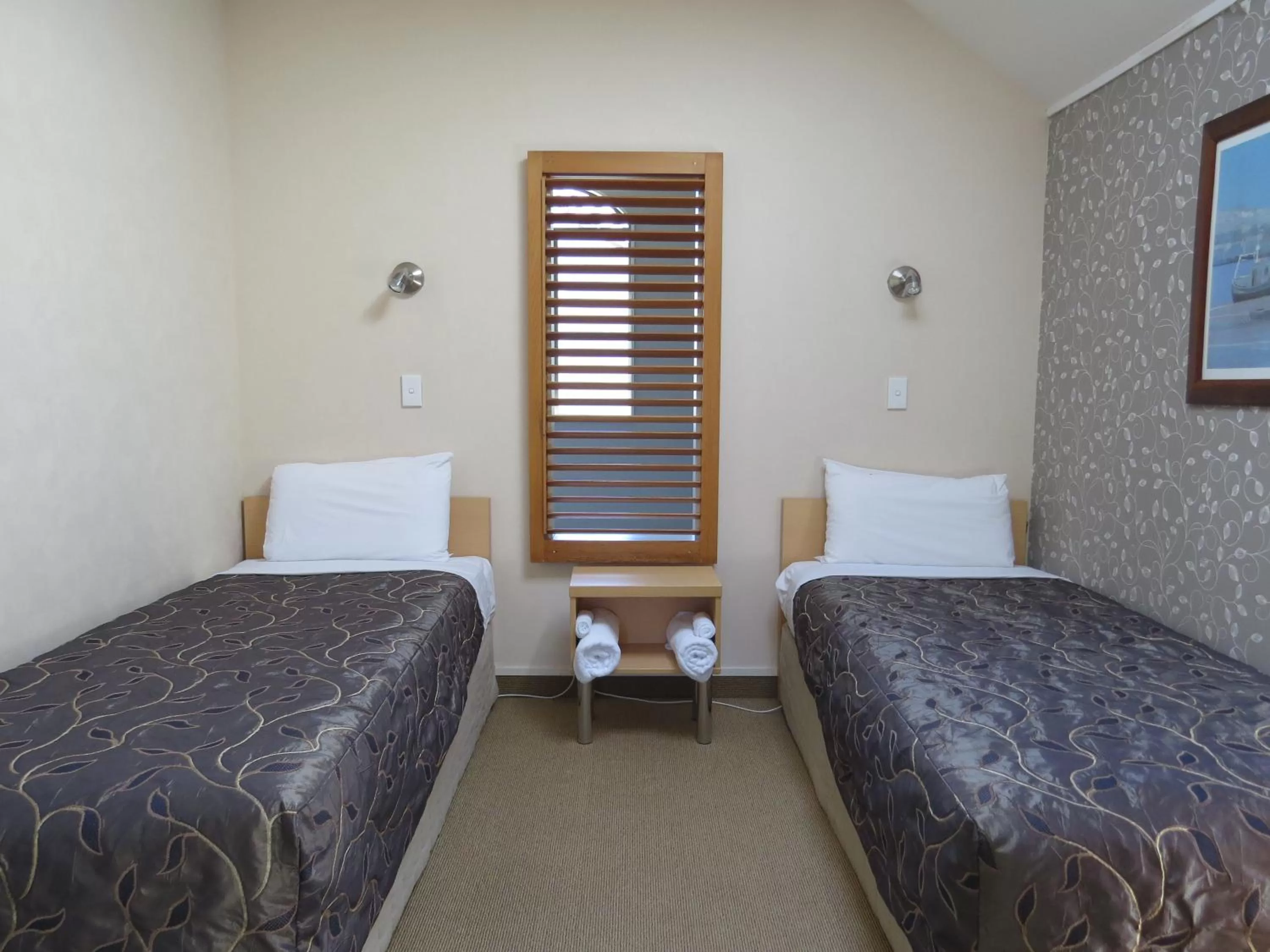 Bed in Voyager Apartments Taupo