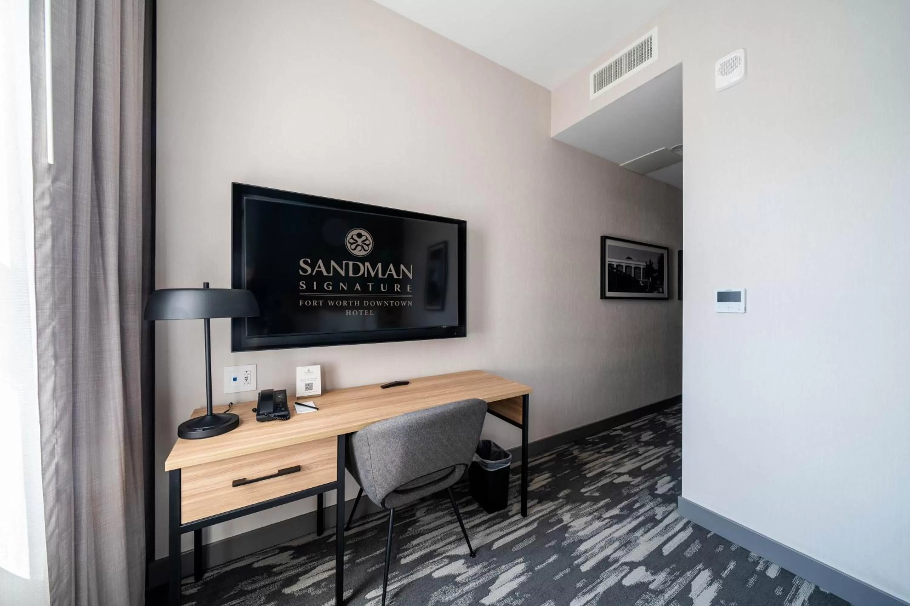 Photo of the whole room, TV/Entertainment Center in Sandman Signature Fort Worth Downtown Hotel