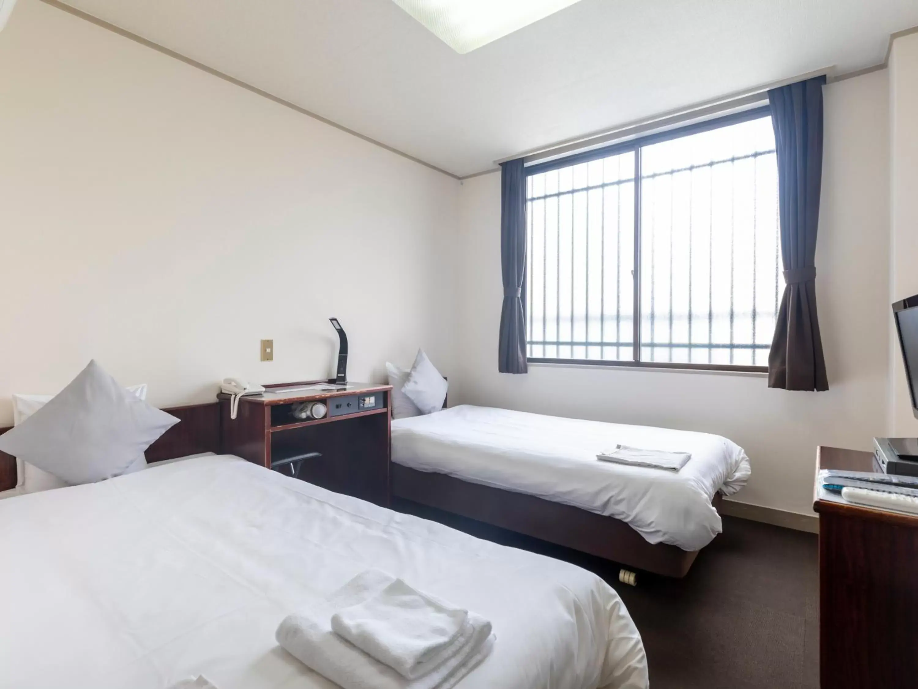 Twin Room - Non-Smoking in Tabist Business Hotel Suehiro Matsuyama Twin Room - Non-Smoking in Tabist Business Hotel Suehiro Matsuyama