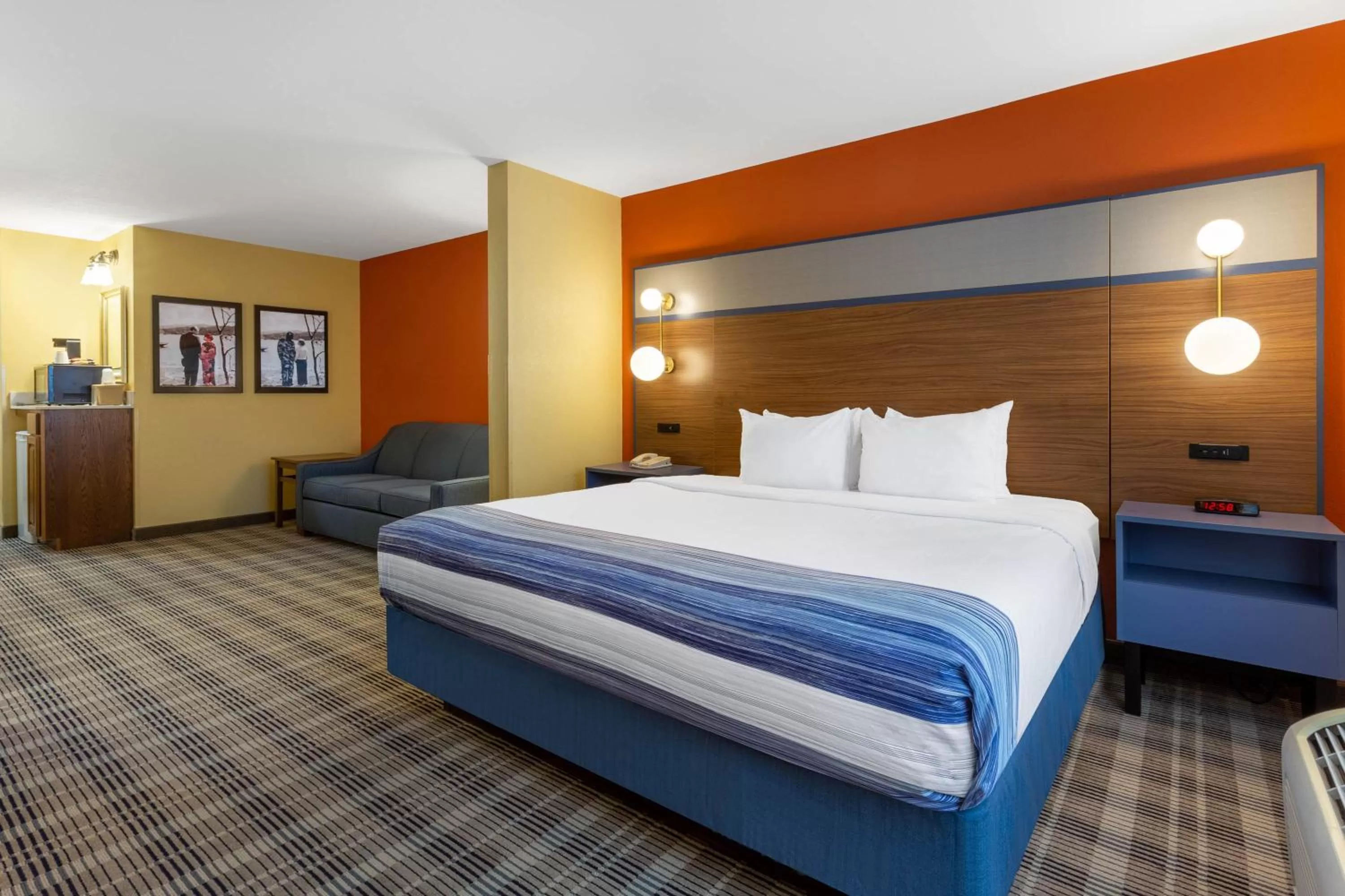Bed in AmericInn by Wyndham Fulton Clinton