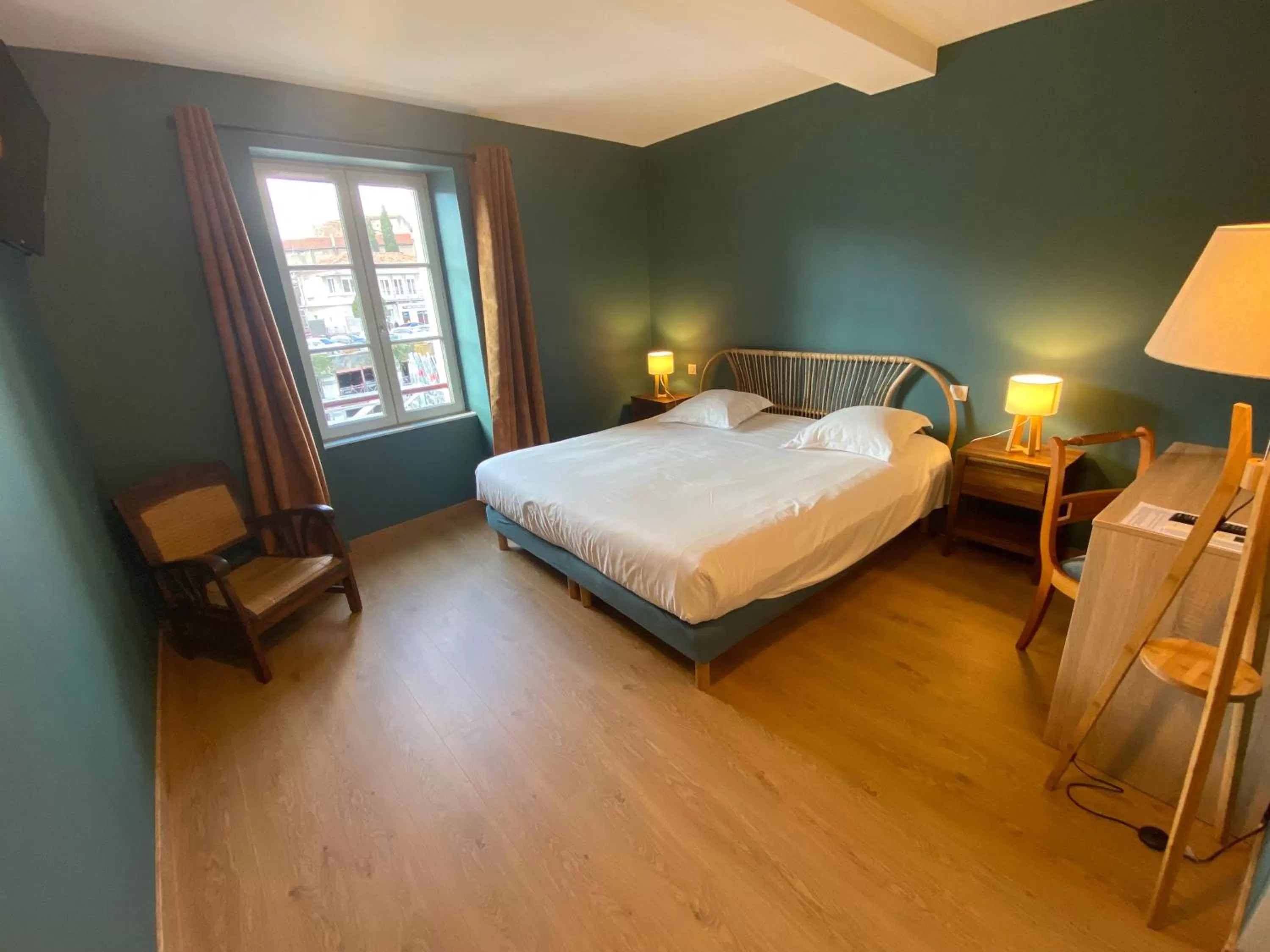 Bedroom in Le Miredames Hôtel-Bar