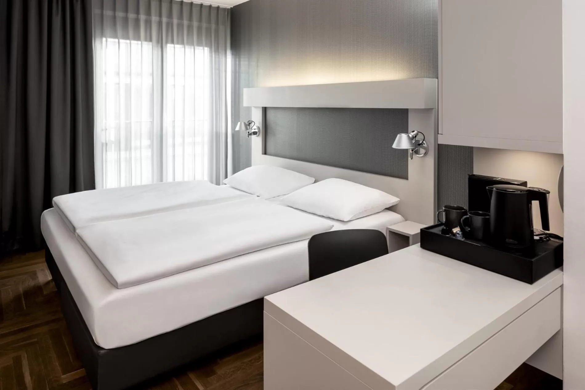 Bed in Hotel AMANO Rooms & Apartments