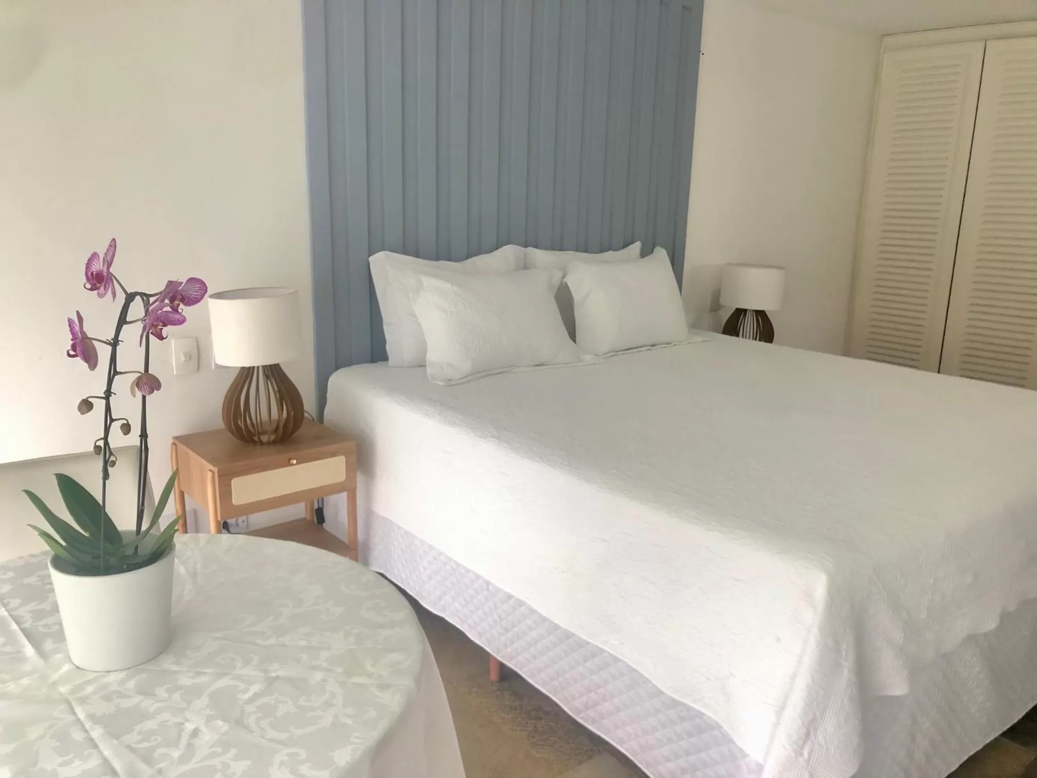 Bed in Guest House Guarujá