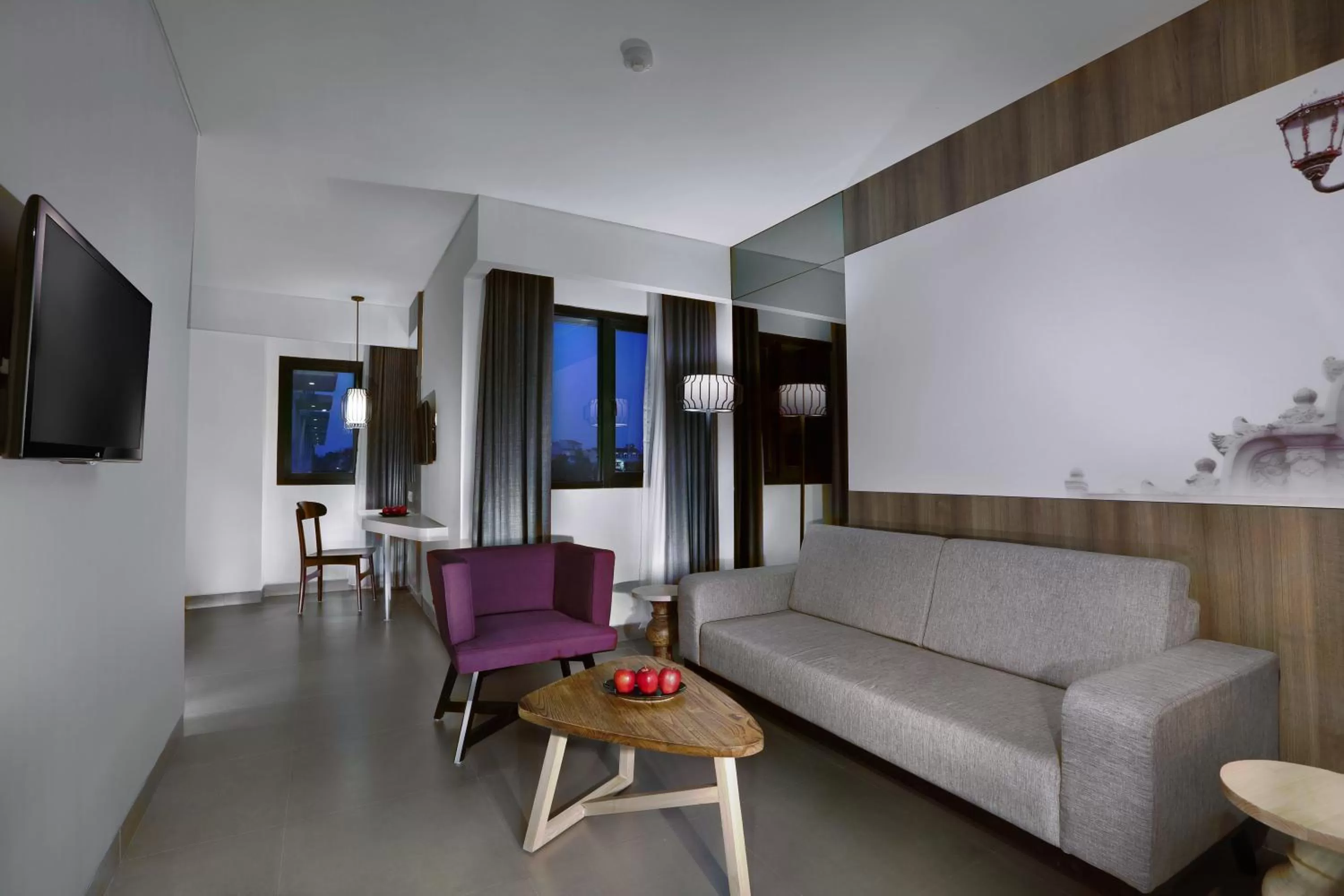 Living room in Hotel Neo Malioboro by ASTON