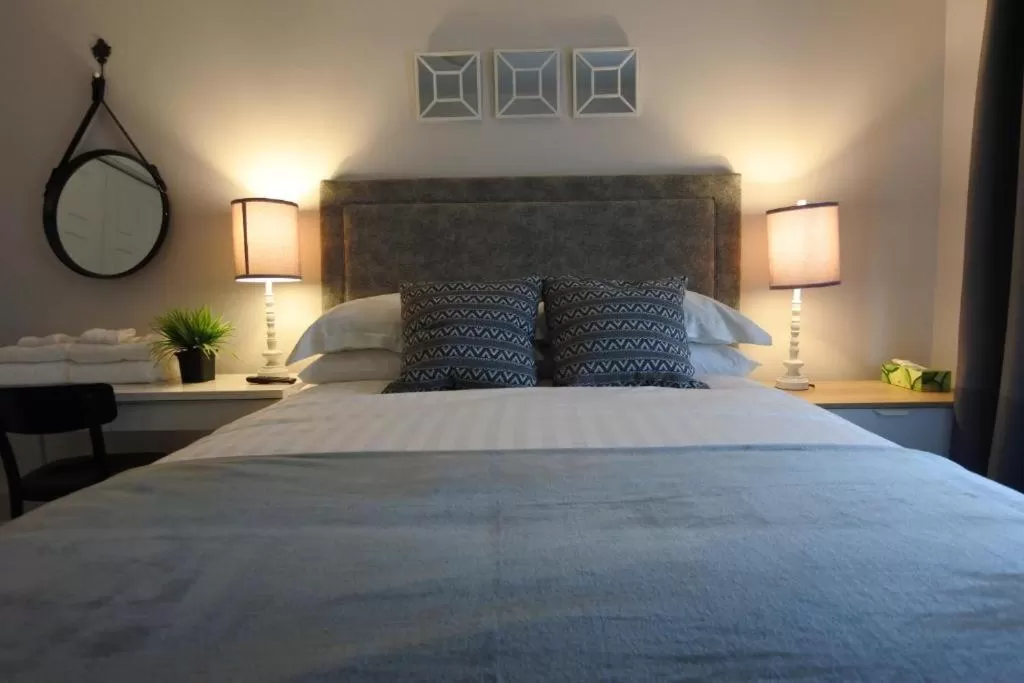 Bed in Black Rooster Guesthouse