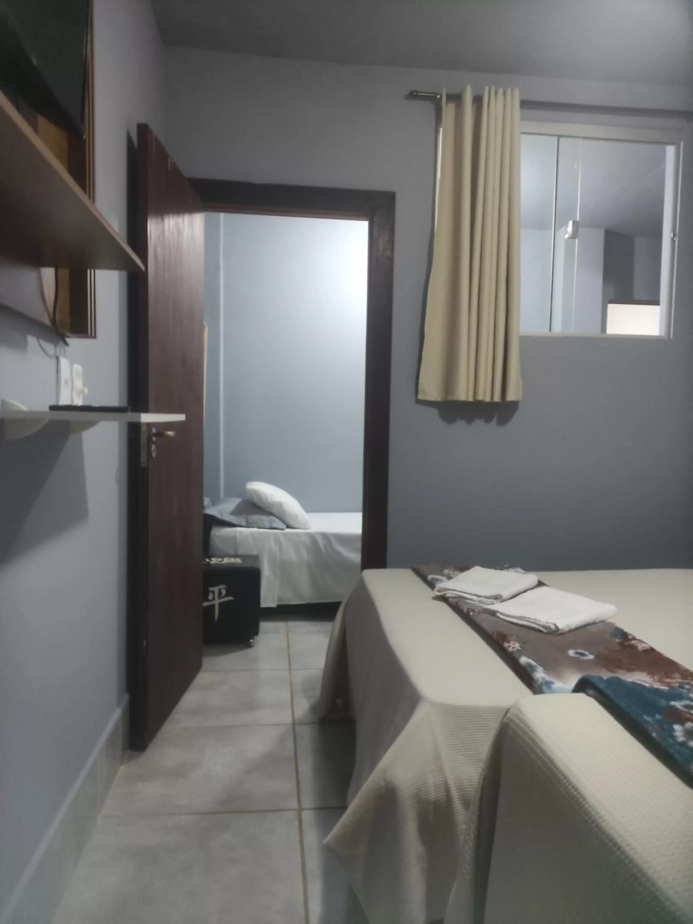 Bed in Pousada da Gi Suítes e Turismo