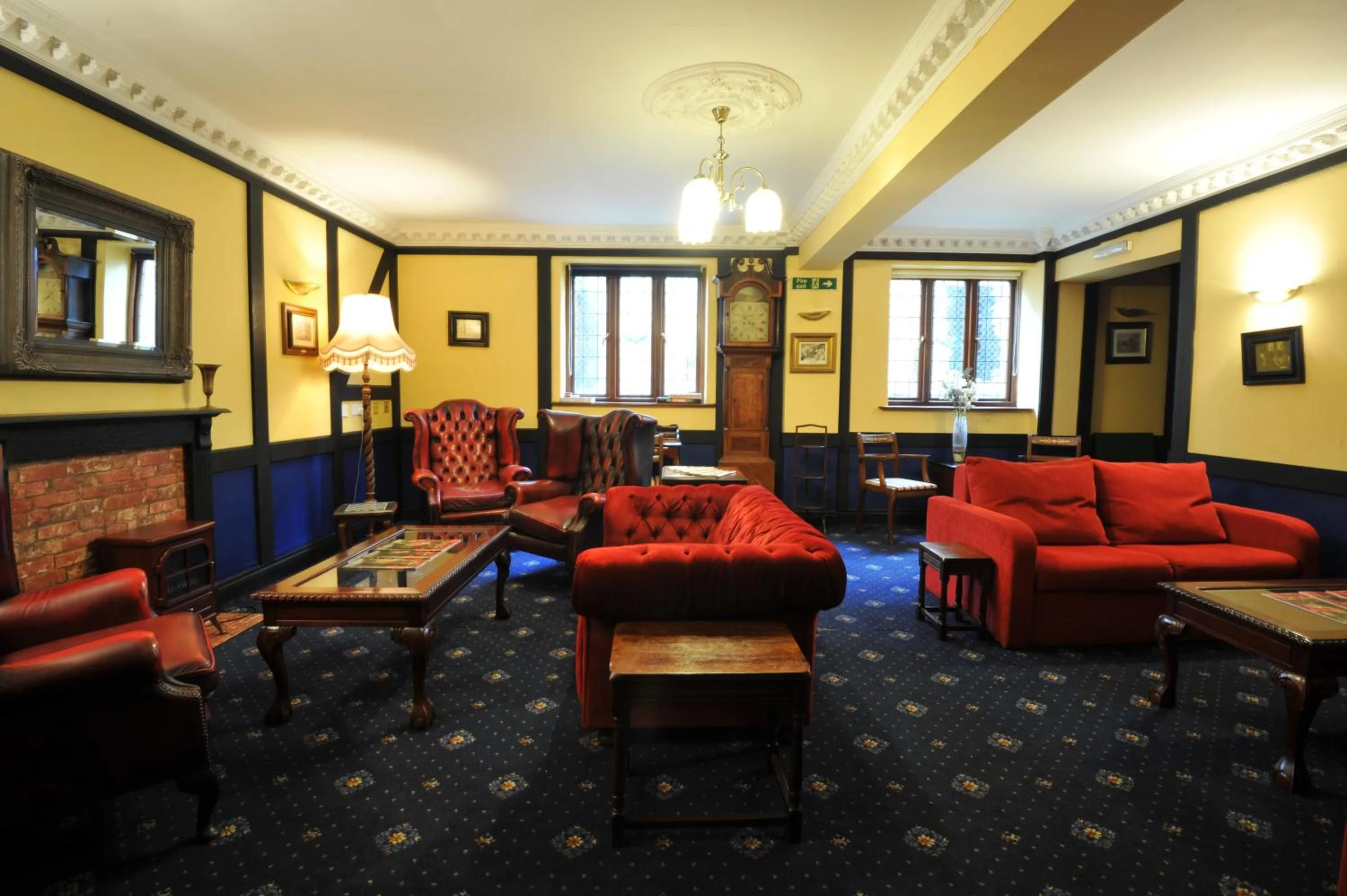 Seating area in Crown & Cushion Hotel