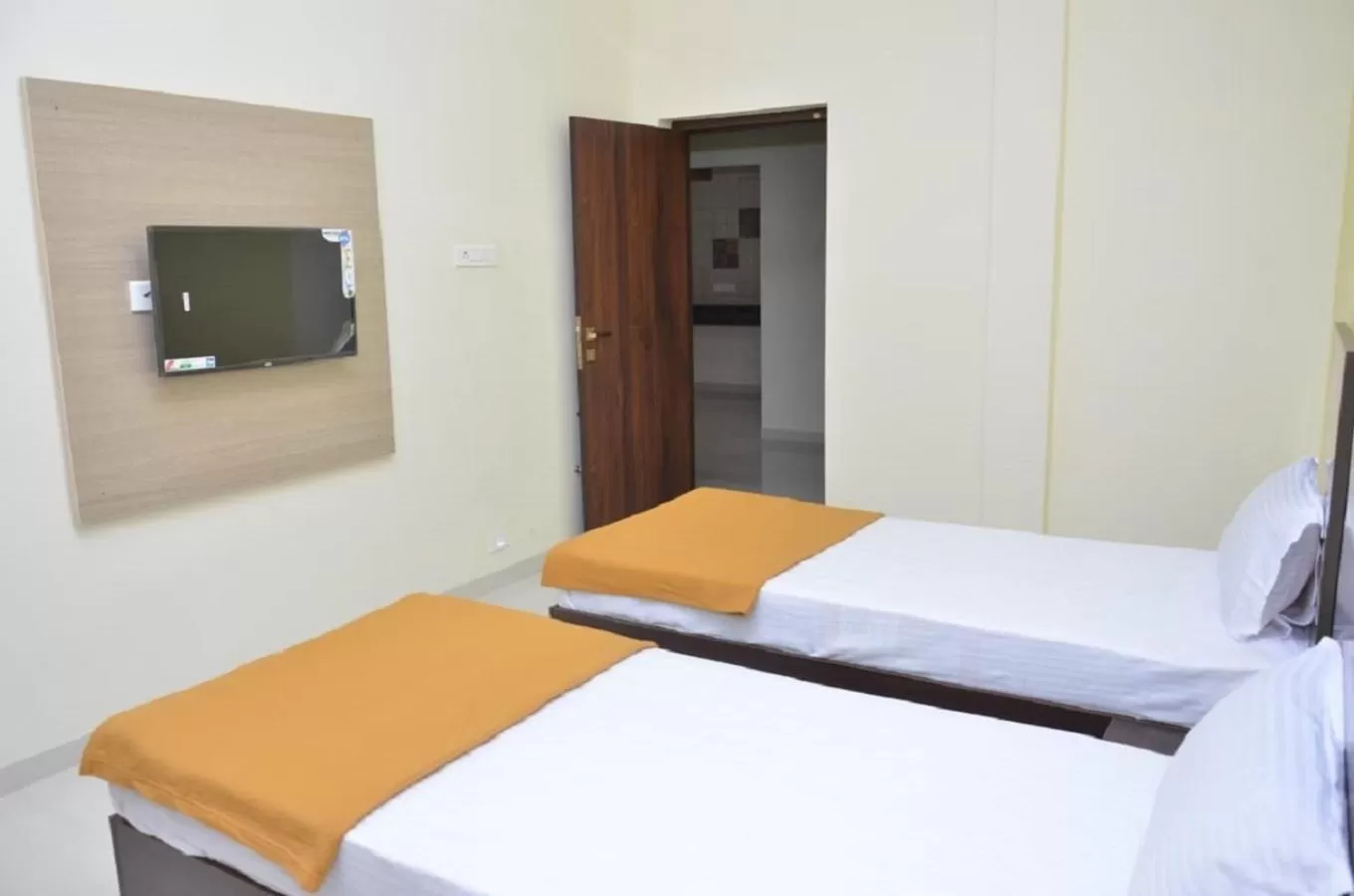 Bed in THE SURRYA MAX RESIDENCY