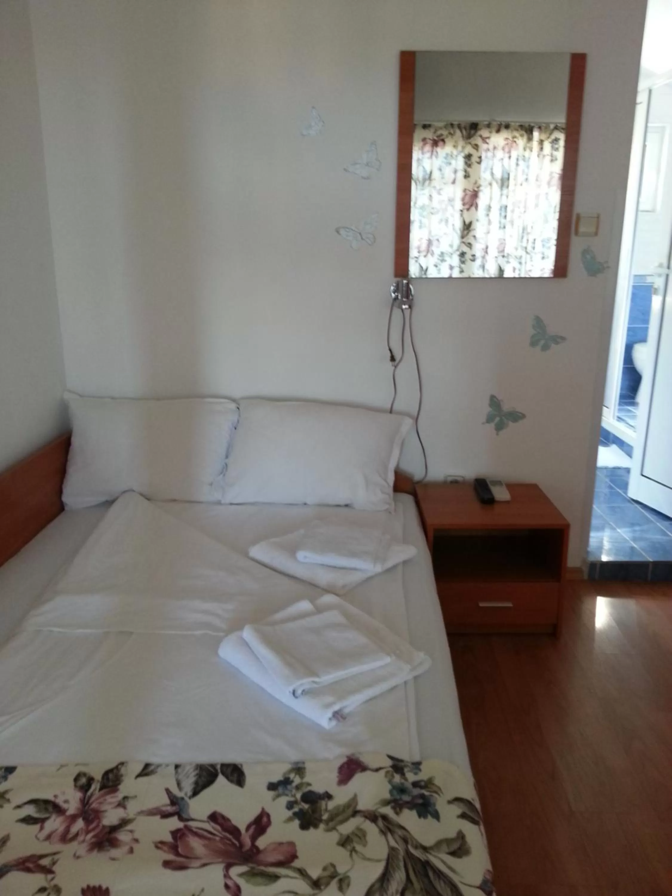 Bed in Hotel Poseidon