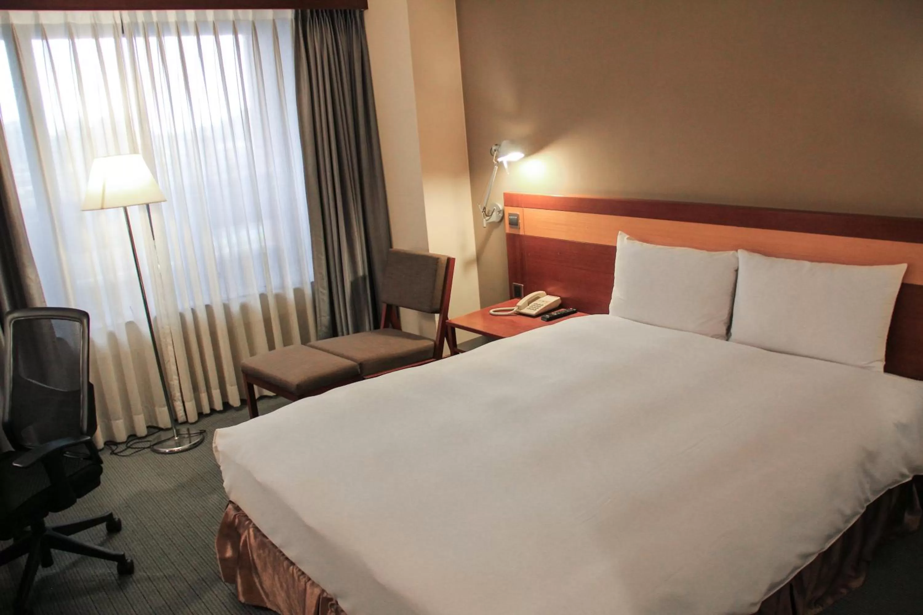 Bed in Guide Hotel Hsinchu Zhongyang