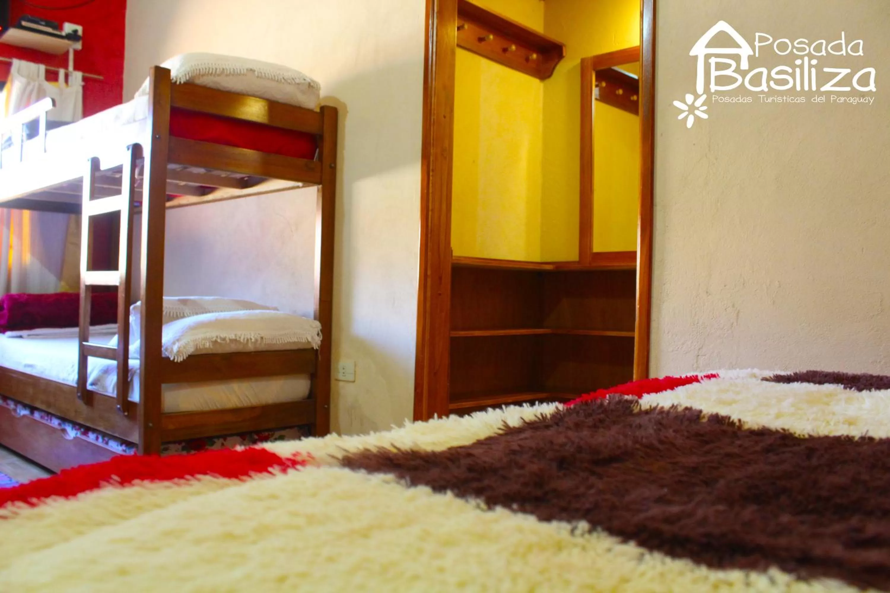 Photo of the whole room, Bed in Posada Basiliza, Encarnación PY