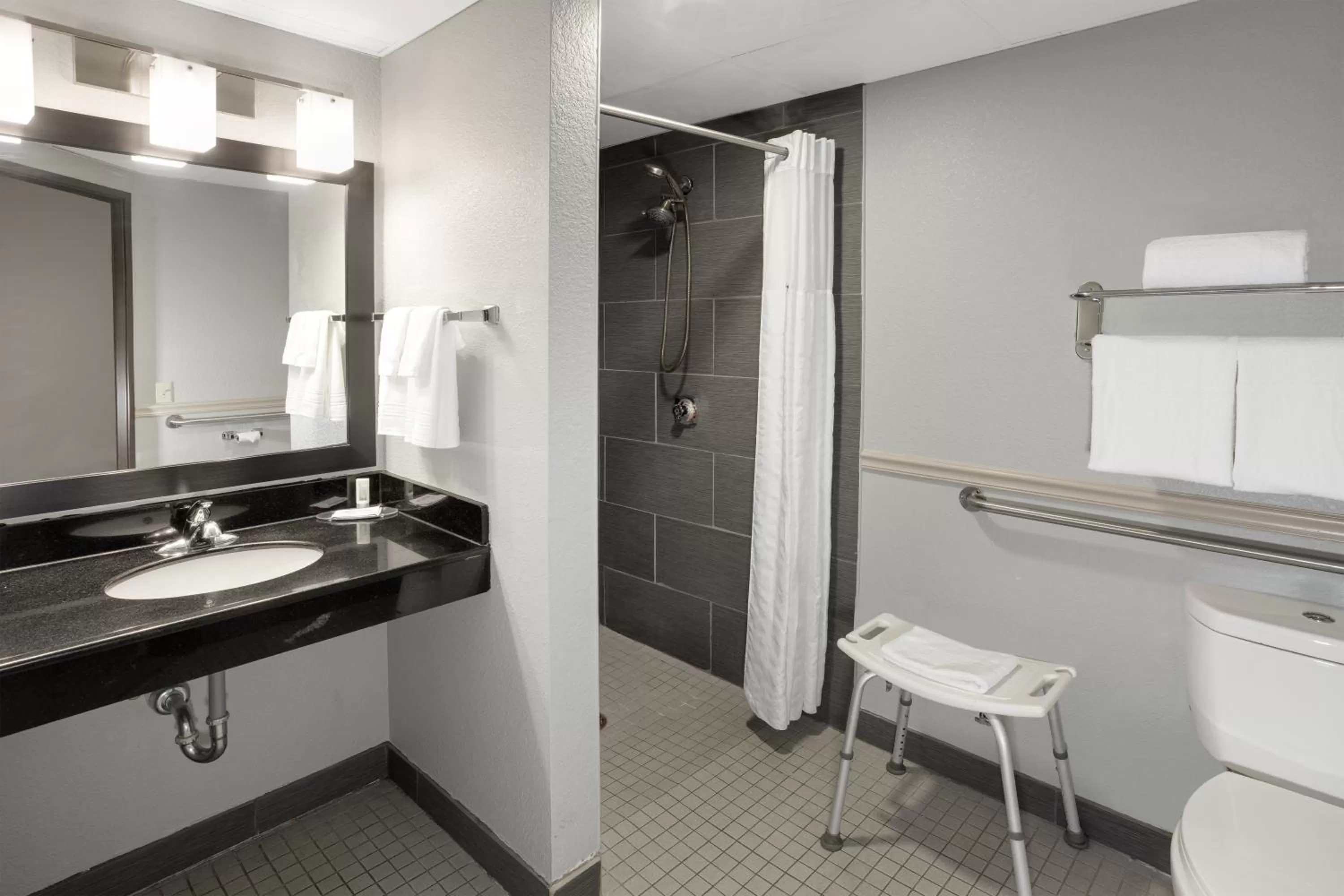 Bathroom in AmericInn by Wyndham Plover Stevens Point