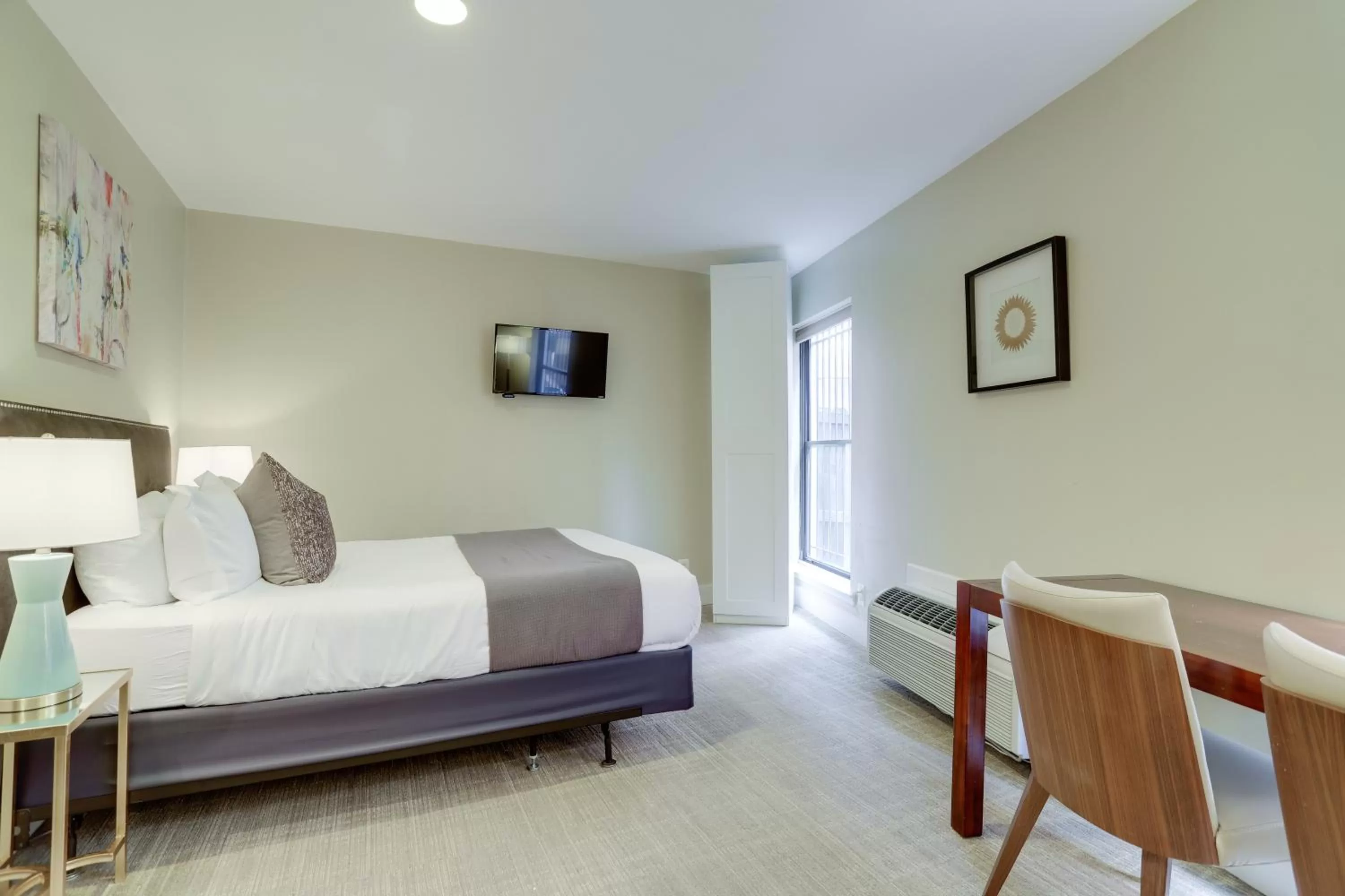 Bed in Sojourn at DuPont Place