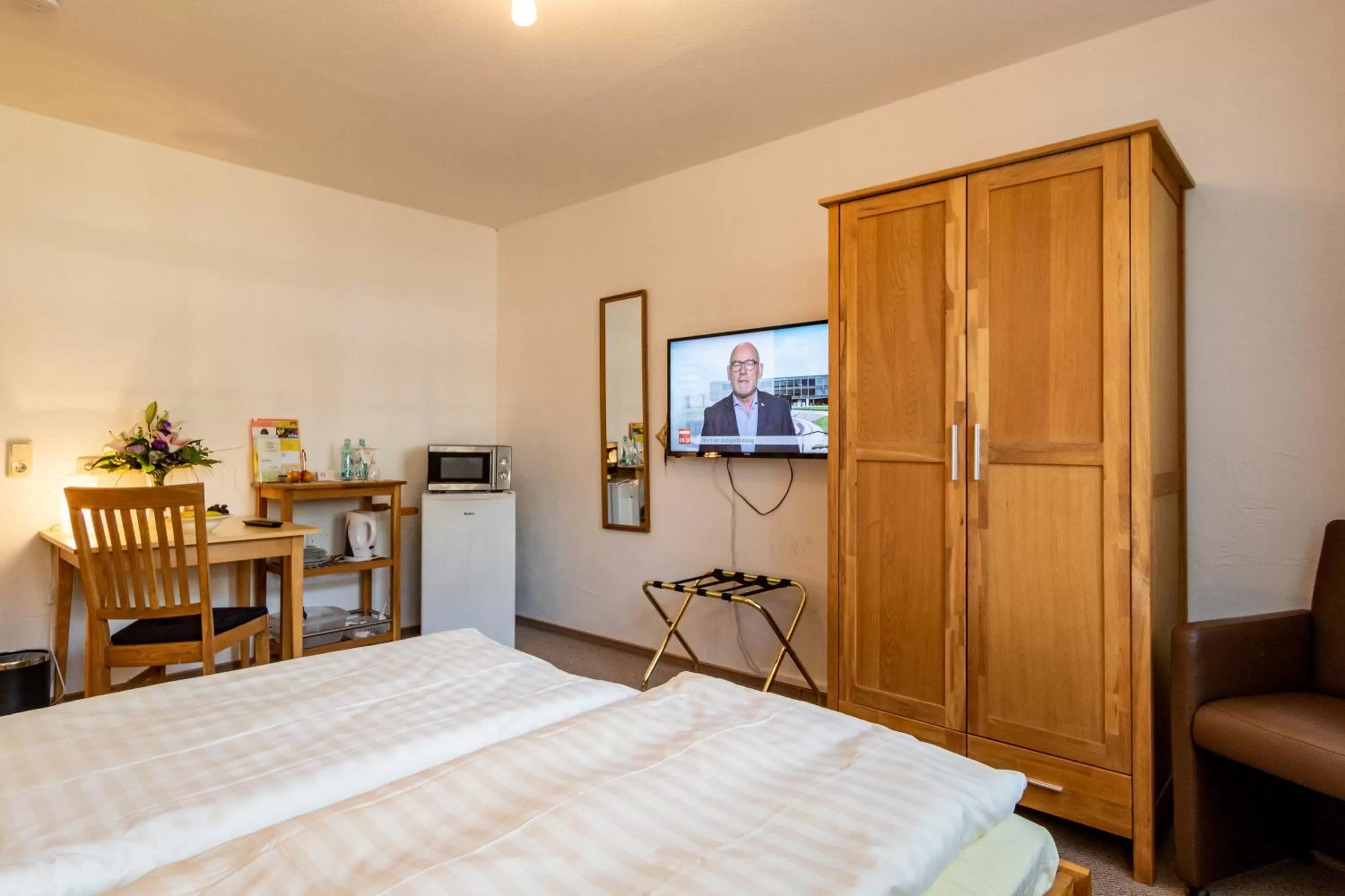 Photo of the whole room, Bed in Hotel Goldflair am Rathaus