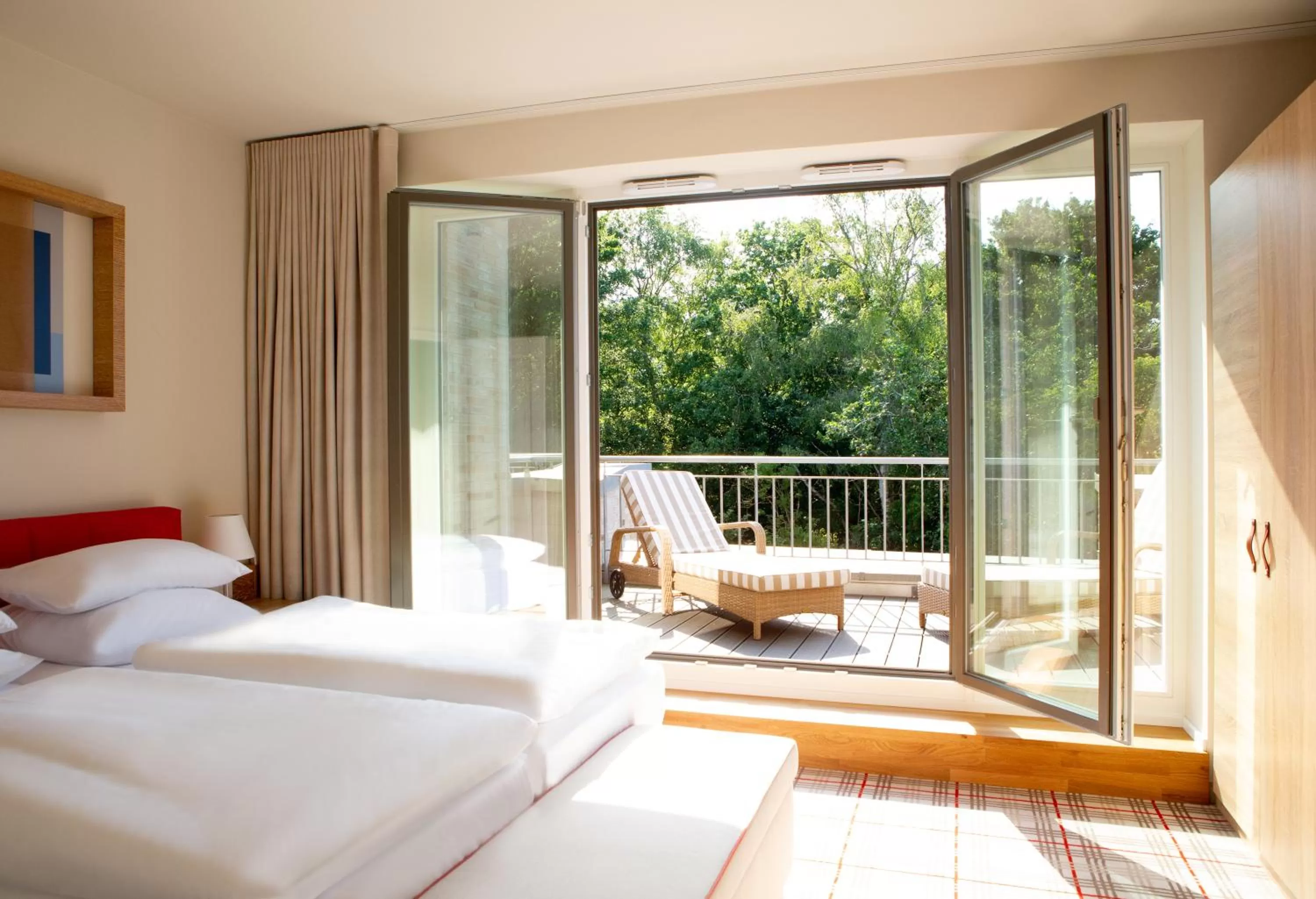 Balcony/Terrace, Bed in Aalernhüs hotel & spa