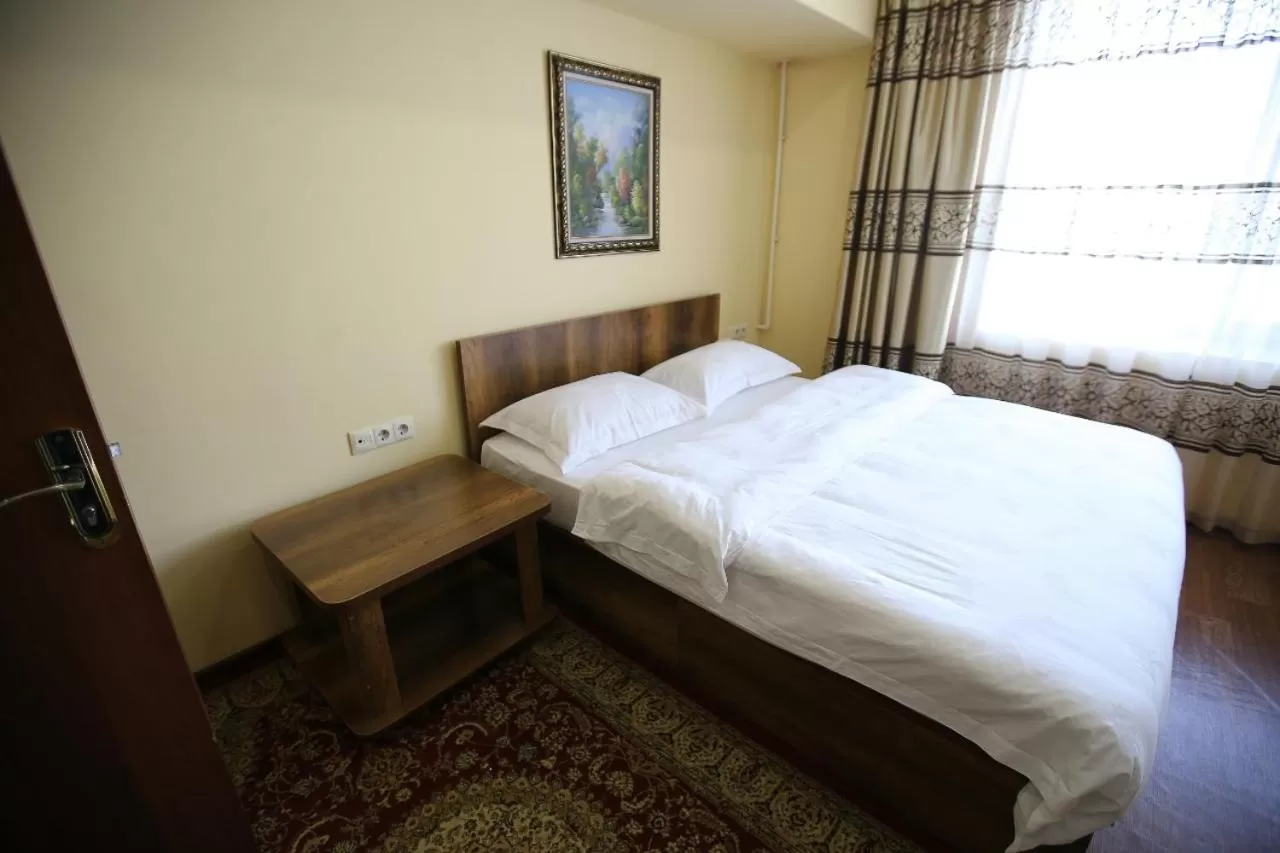 Bed in Altai Business Hotel