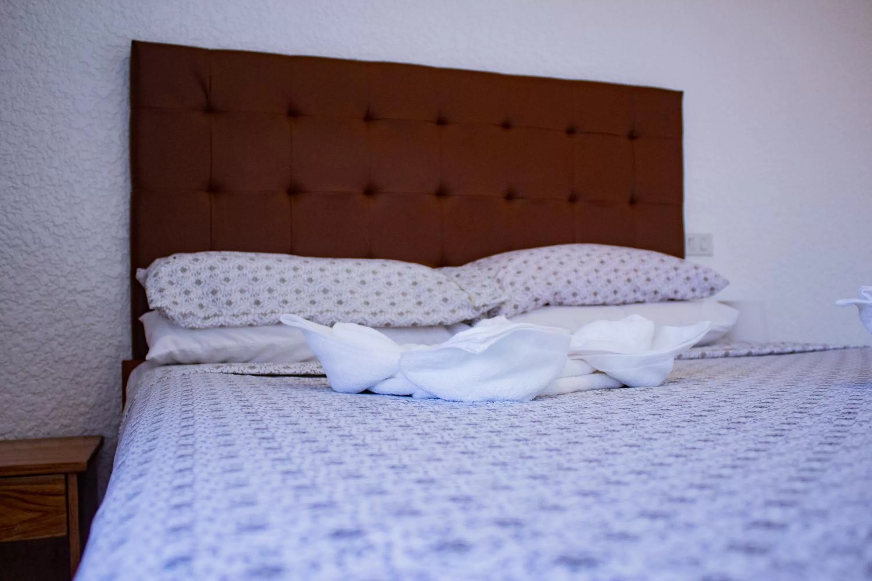 Bed in Jugalis Hotel and Restaurant