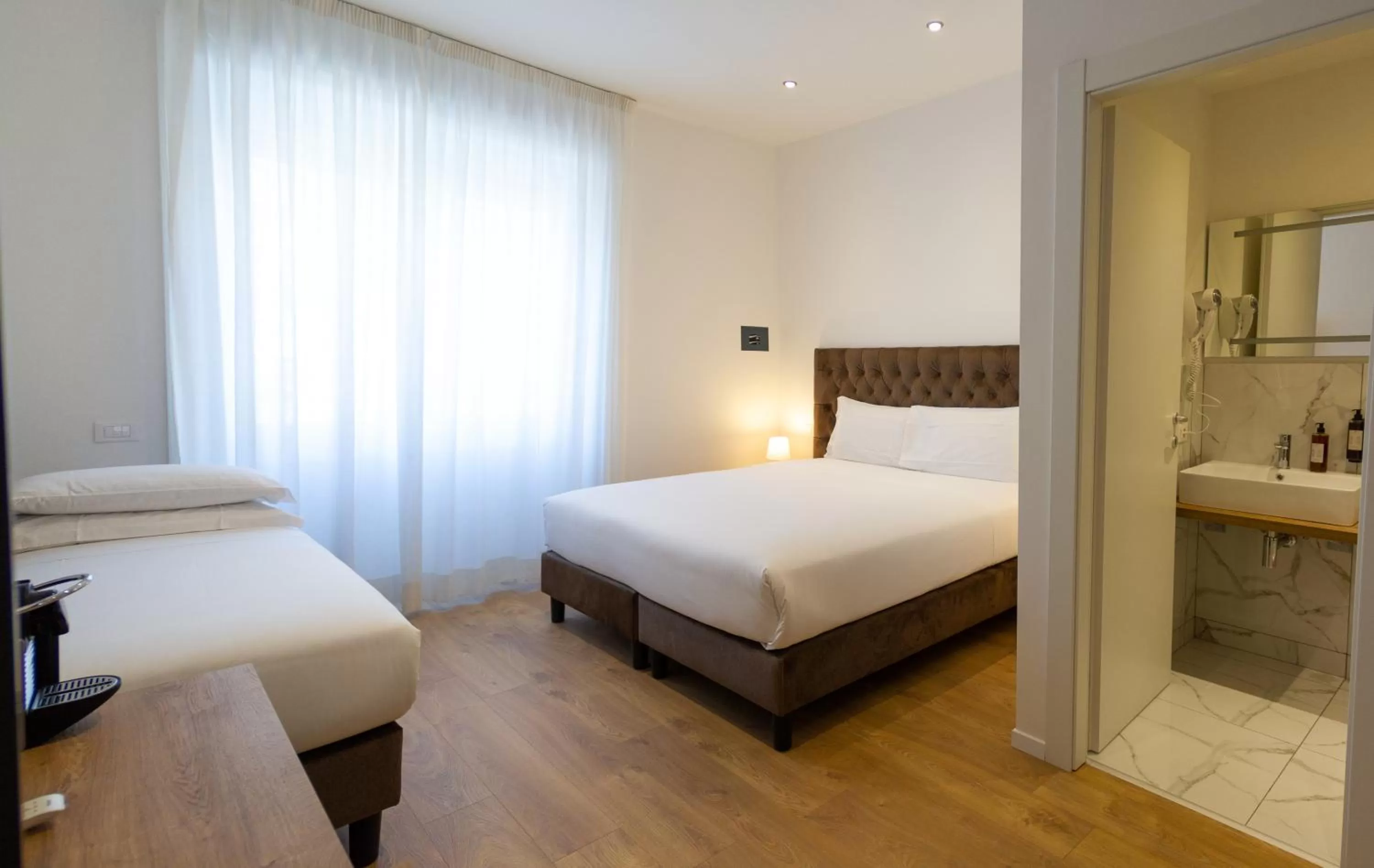 Bed in Michelangelo Vatican Rooms