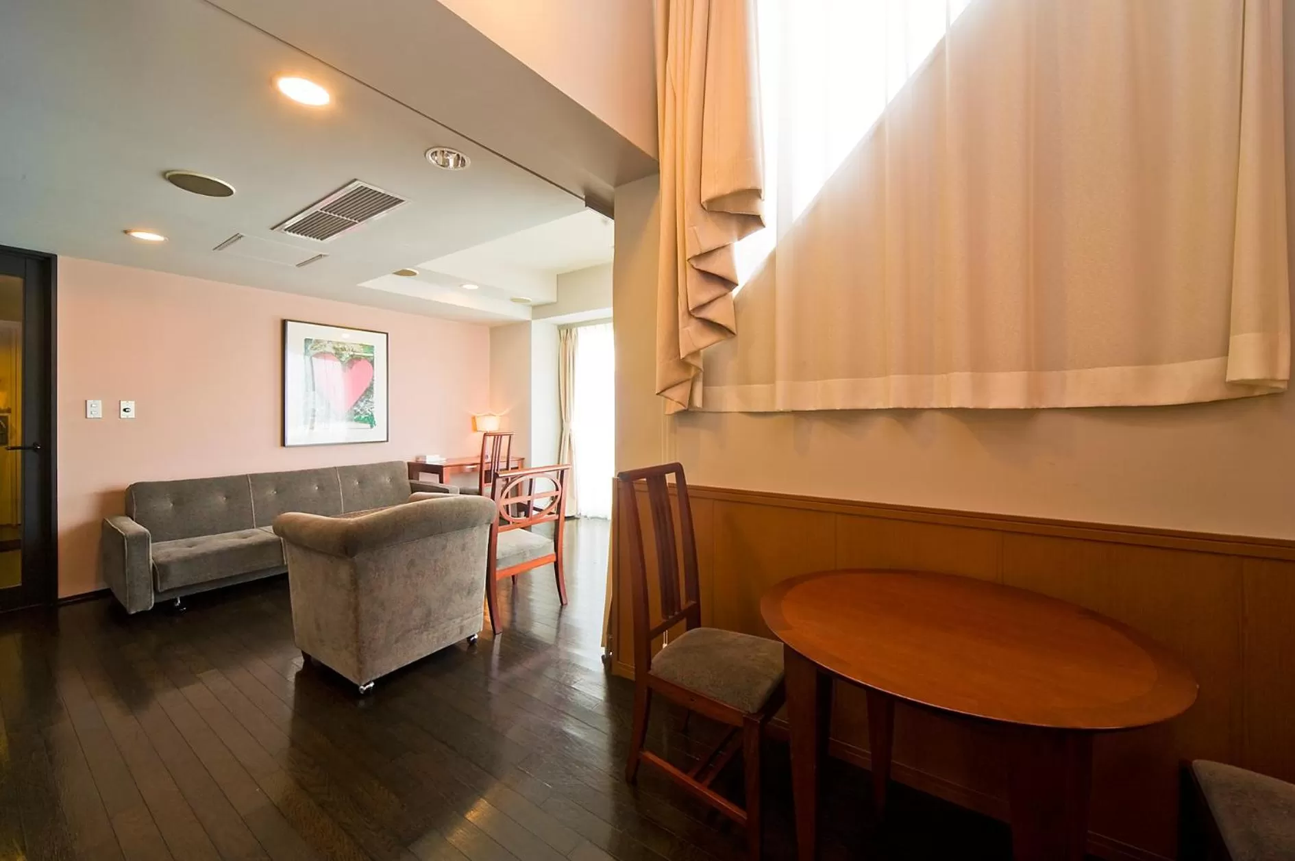 Living room, Bed in The Residential Suites Fukuoka