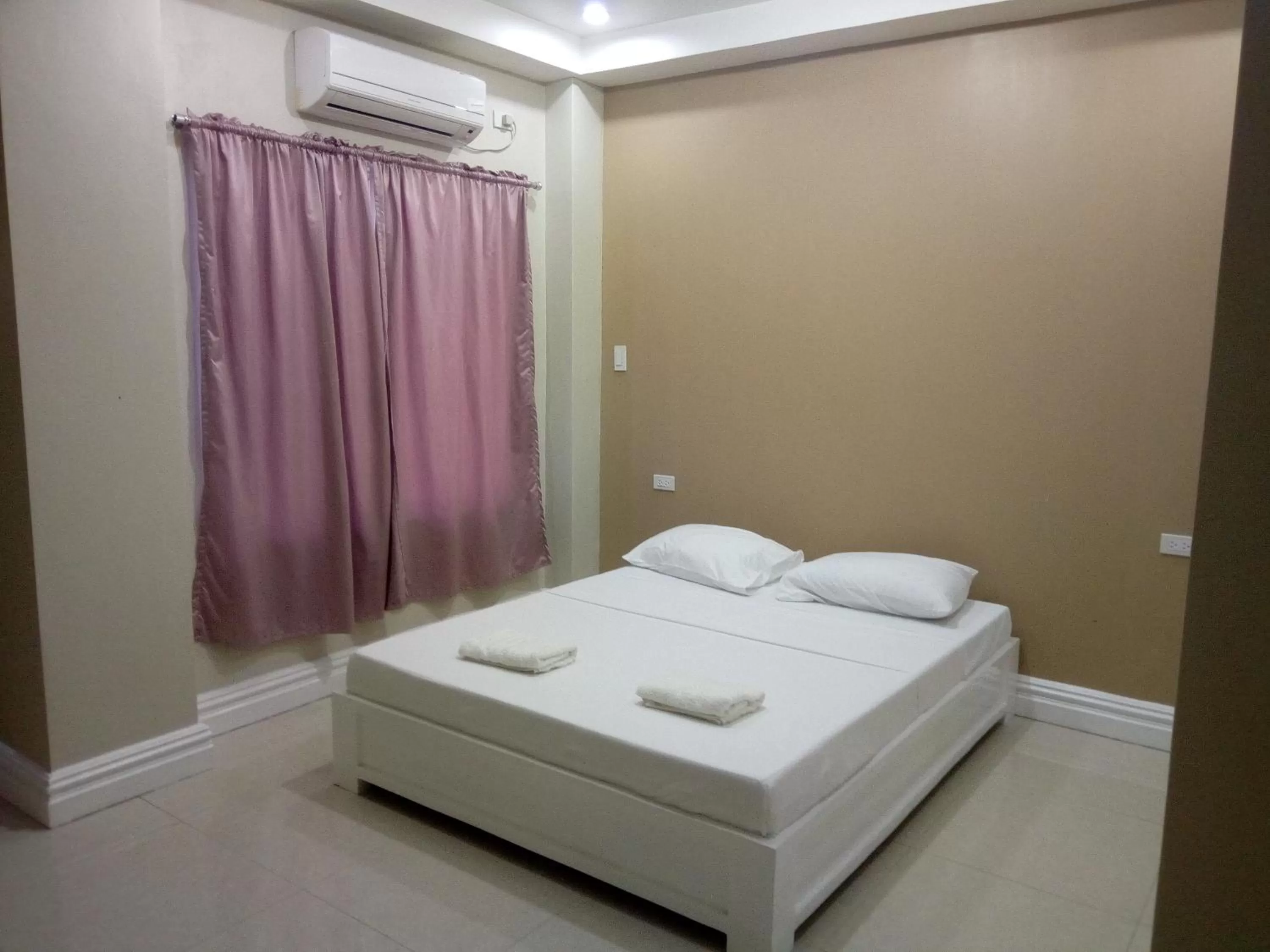 Bed in Sandscape Hotel