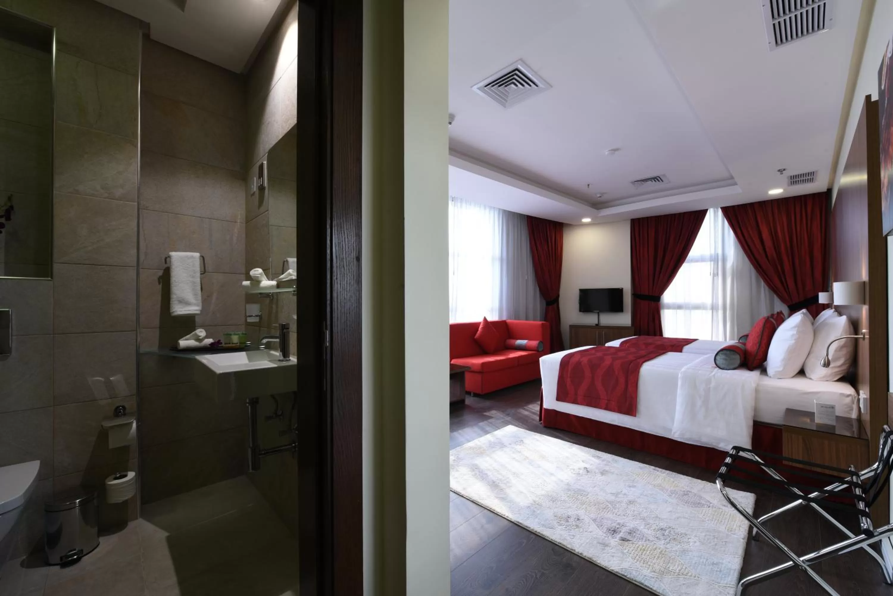 Bed in Ramada Encore by Wyndham Kuwait Downtown