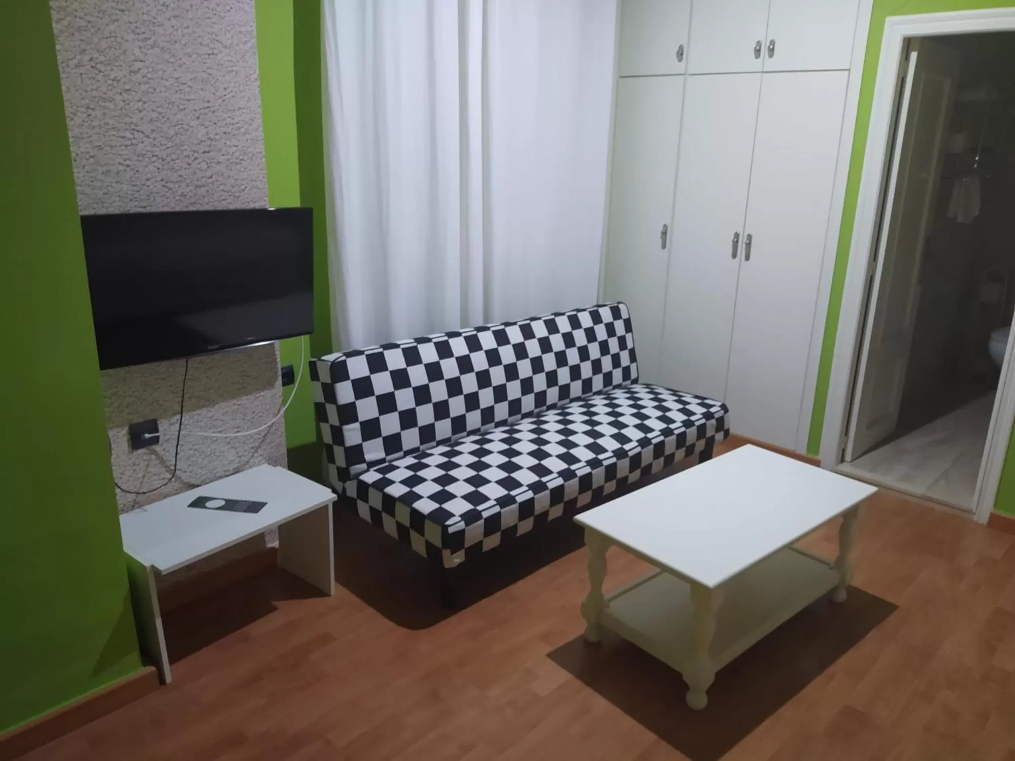 Communal lounge/ TV room in Hotel Aro'S