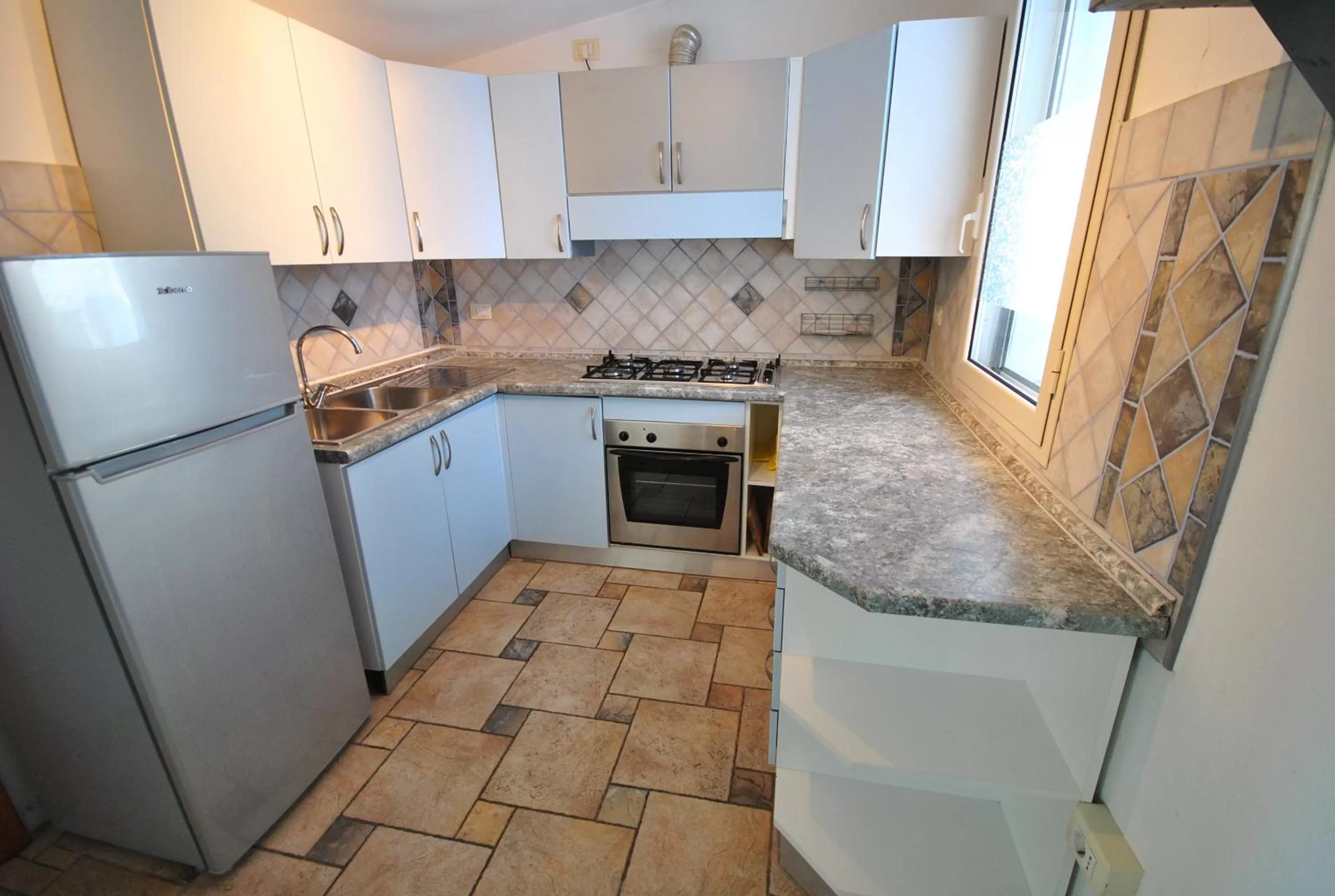 Kitchen or kitchenette in Holiday Residence Rifugio