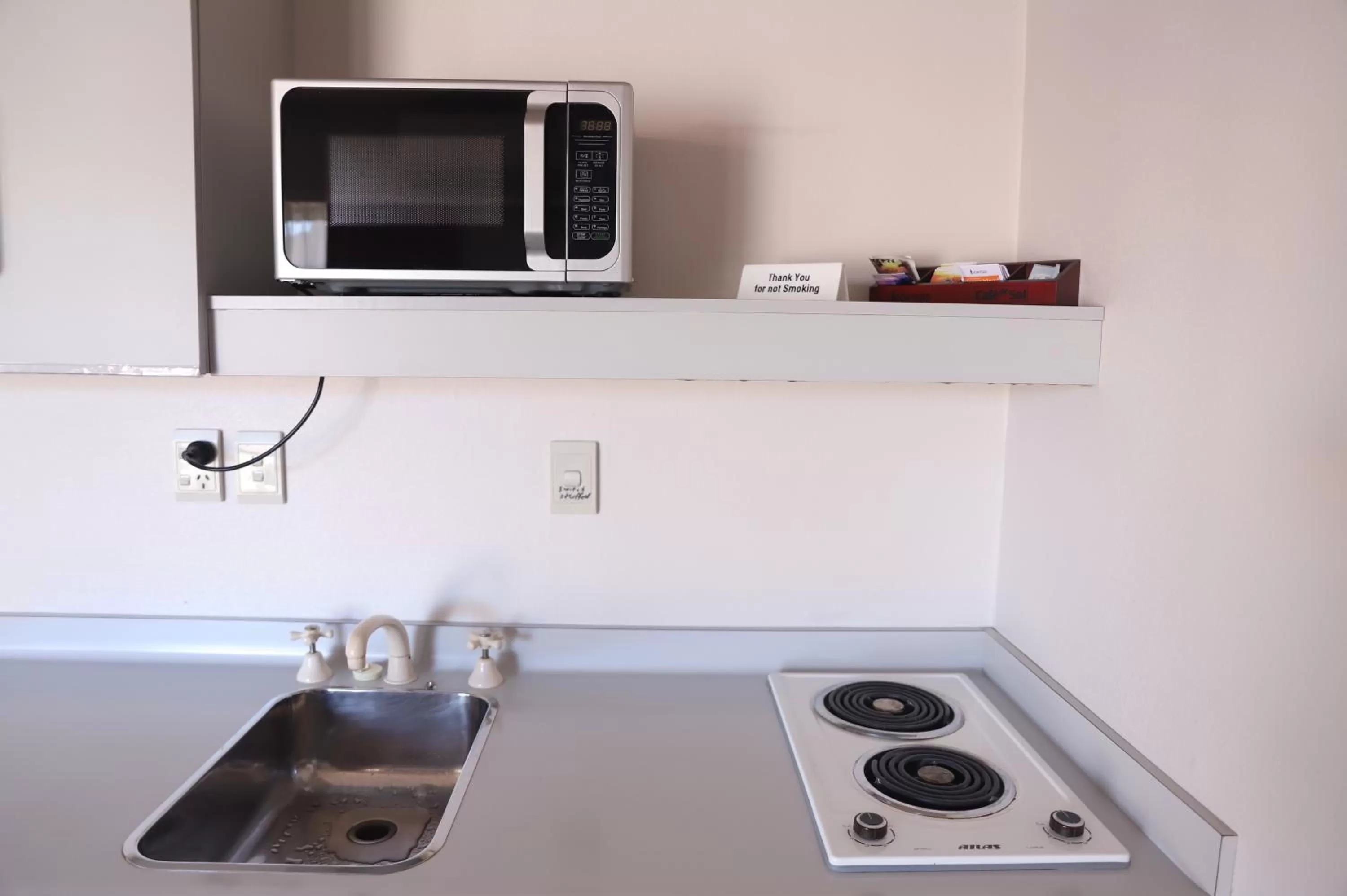 Kitchen or kitchenette in The Village Inn Hotel