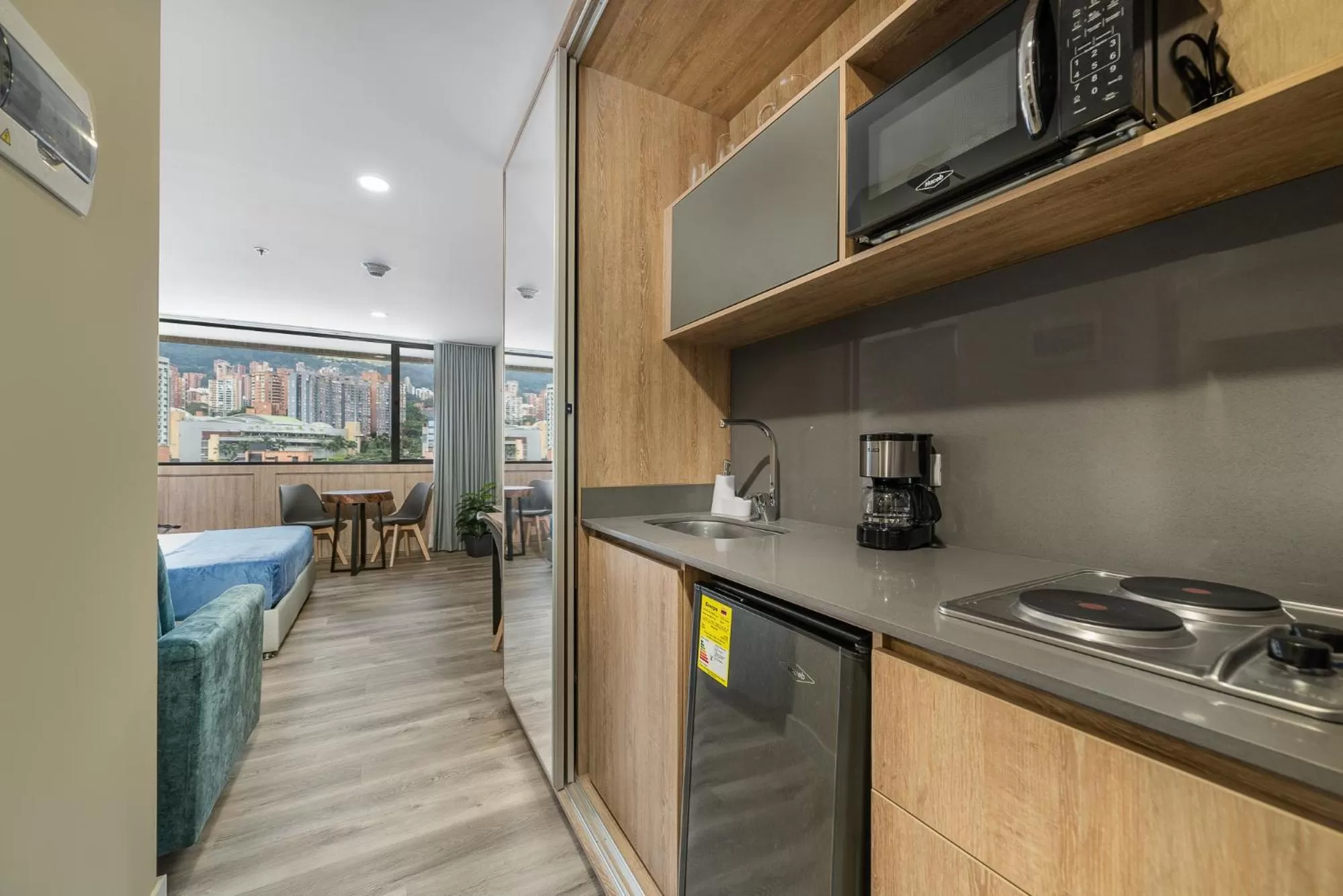 Kitchen or kitchenette in Apartamentos Go Living & Suites by HOUSY HOST