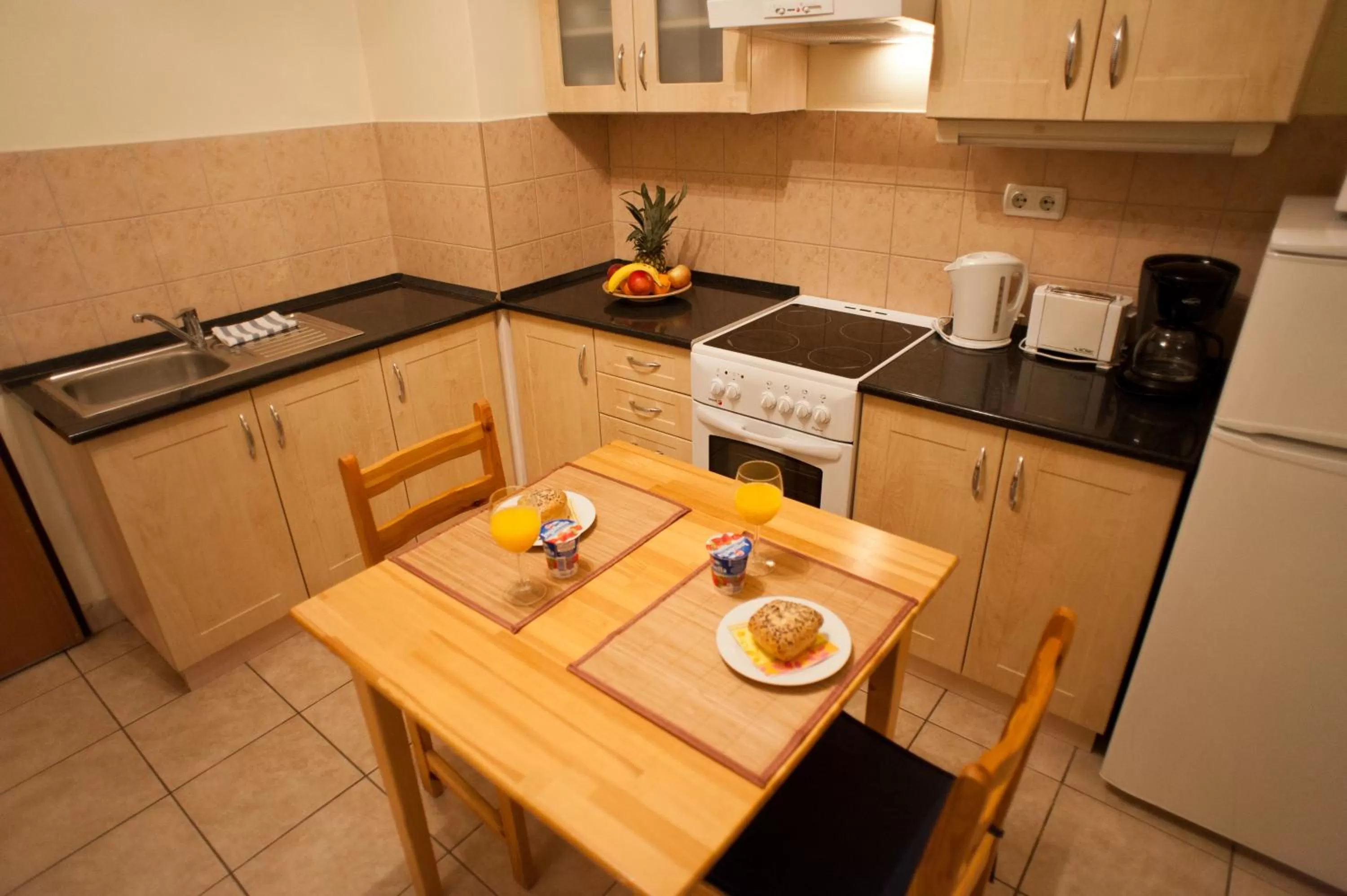 Kitchen or kitchenette in Agape Apartments