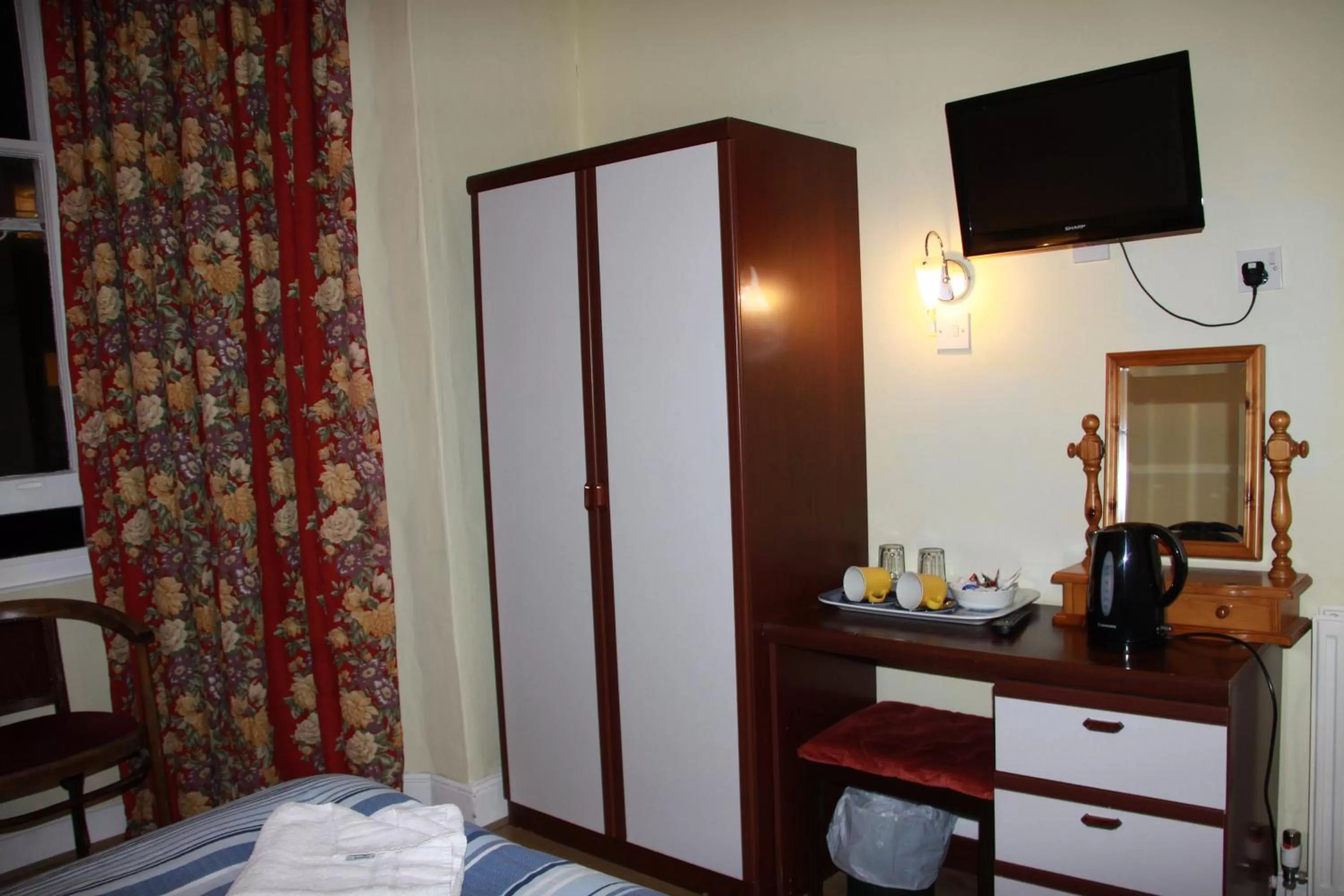 Bed in Ambassador Hotel