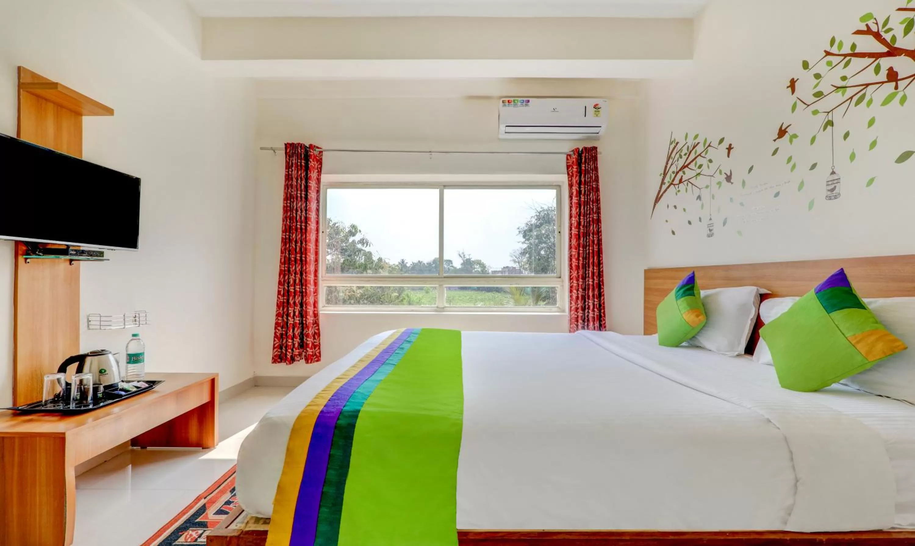 Bedroom, Bed in Treebo Atithi Comforts, 1 Km From Nisargadhama Forest