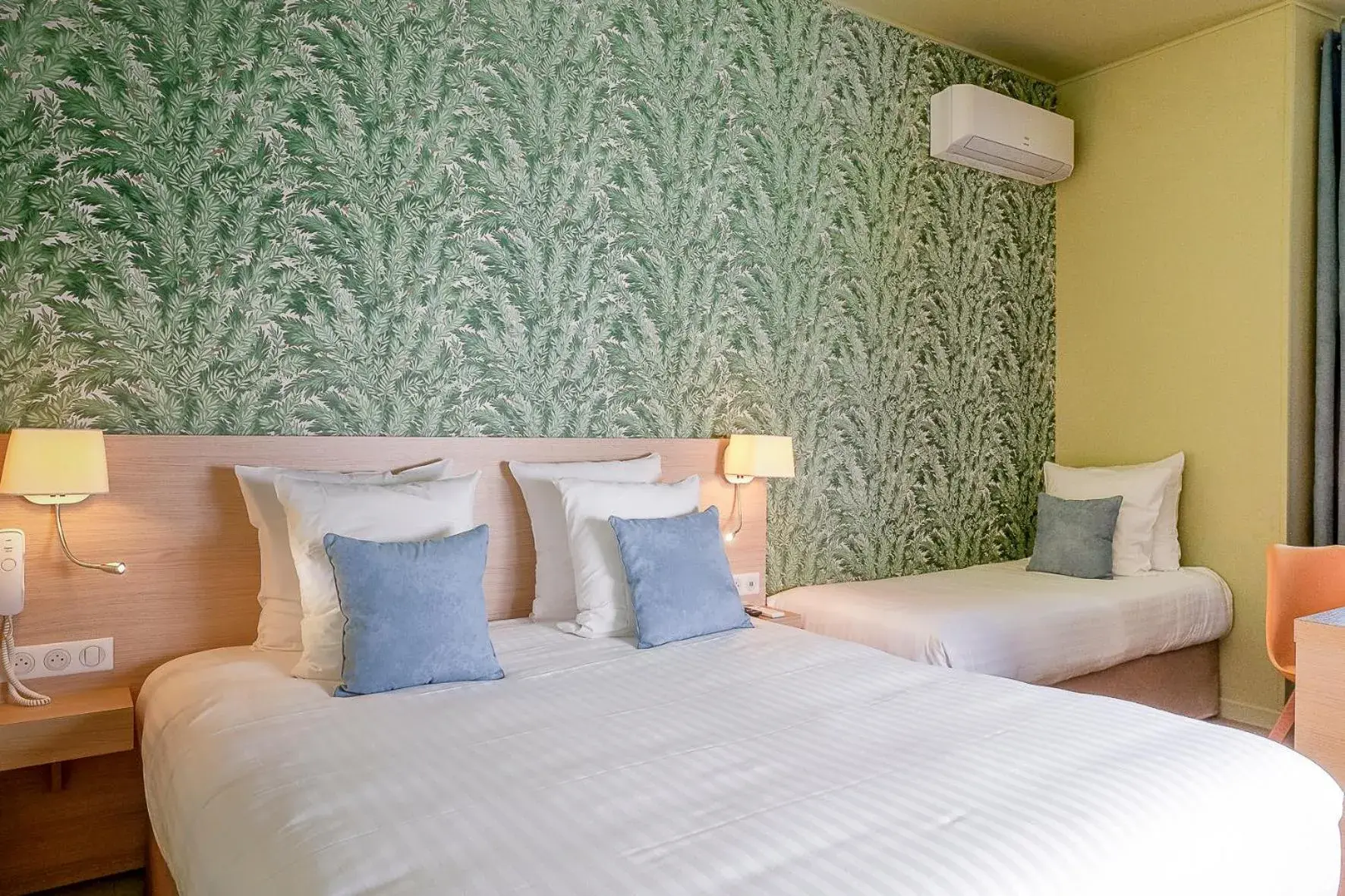 Small Family Room - Courtyard View in Hôtel Du Centre, un hôtel AMMI Small Family Room - Courtyard View in Hôtel Du Centre, un hôtel AMMI