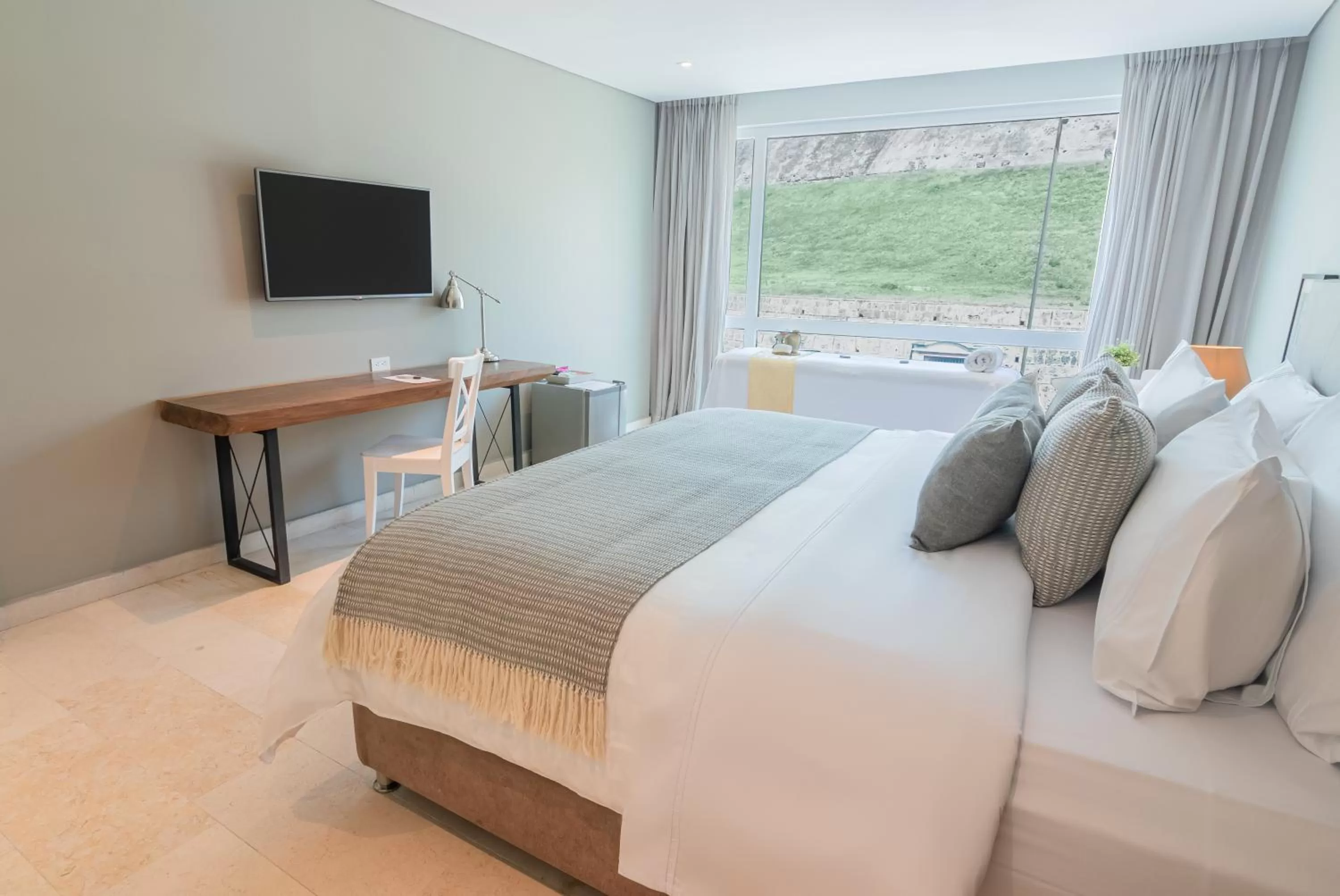 Bed in GHL San Lazaro Art Hotel