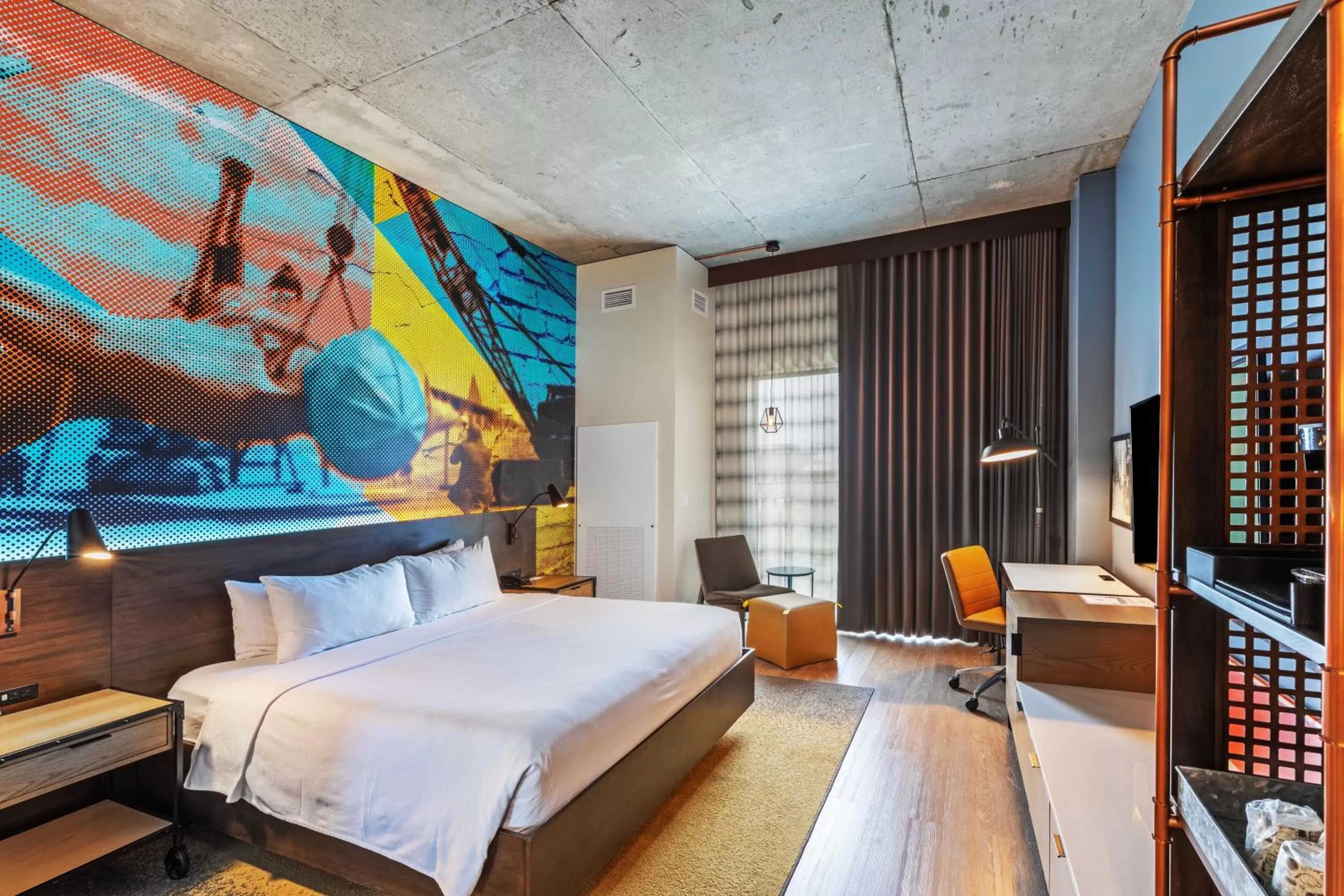 Photo of the whole room, Bed in Hotel Indigo Tulsa DWTN/Entertainment Area