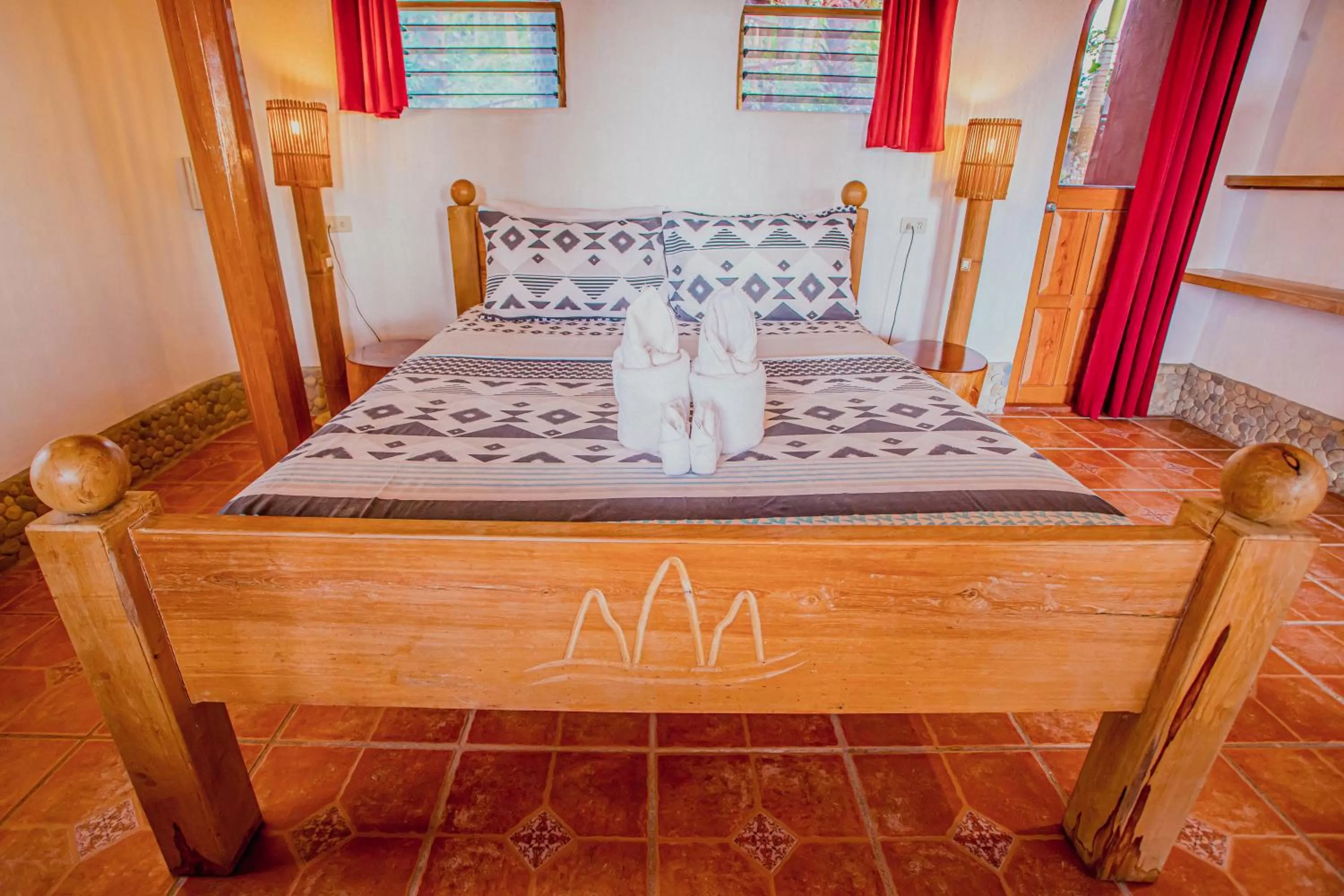 Bed in Atremaru Jungle Retreat