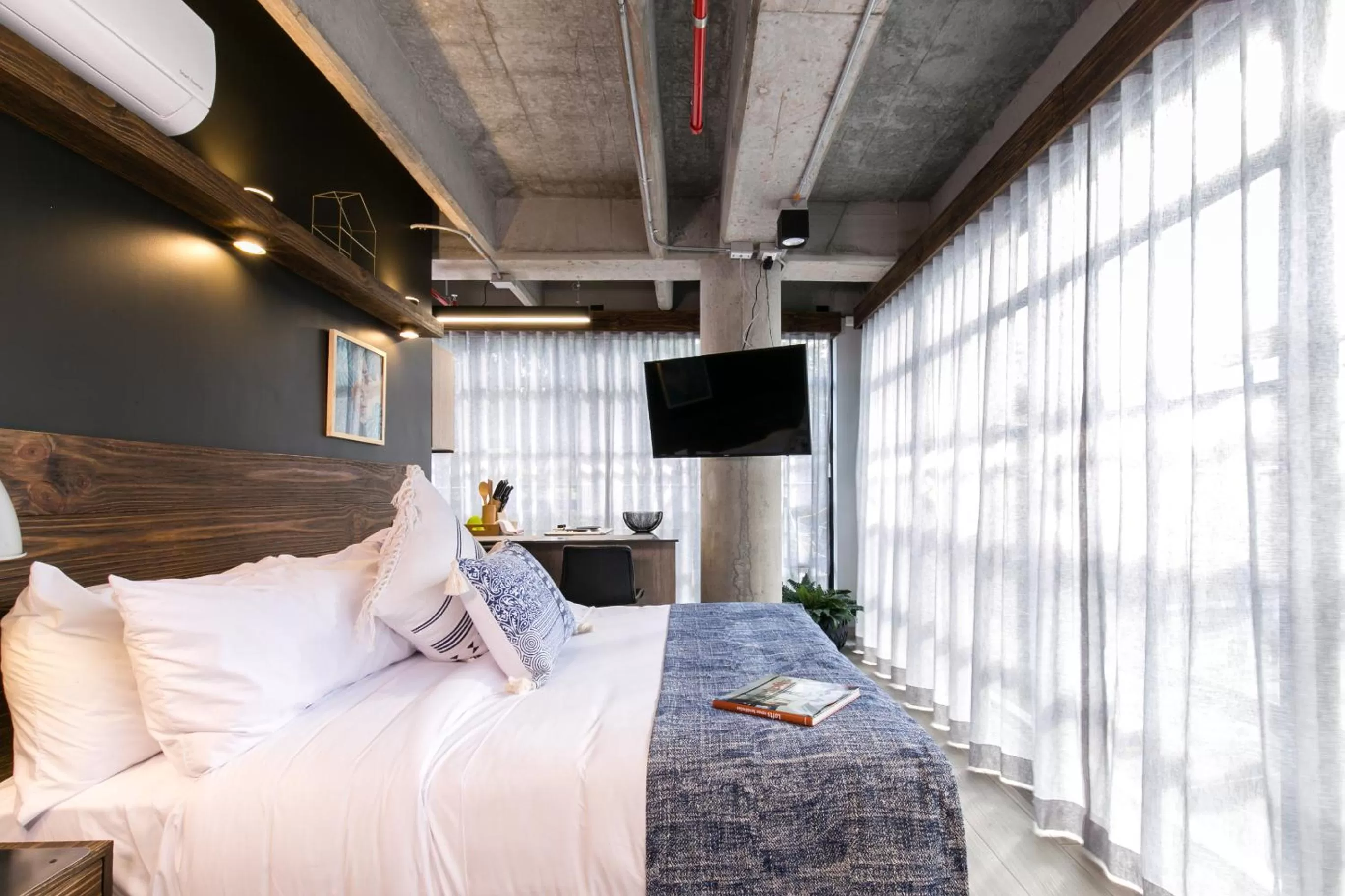 Bed in Factory Lofts Hotel