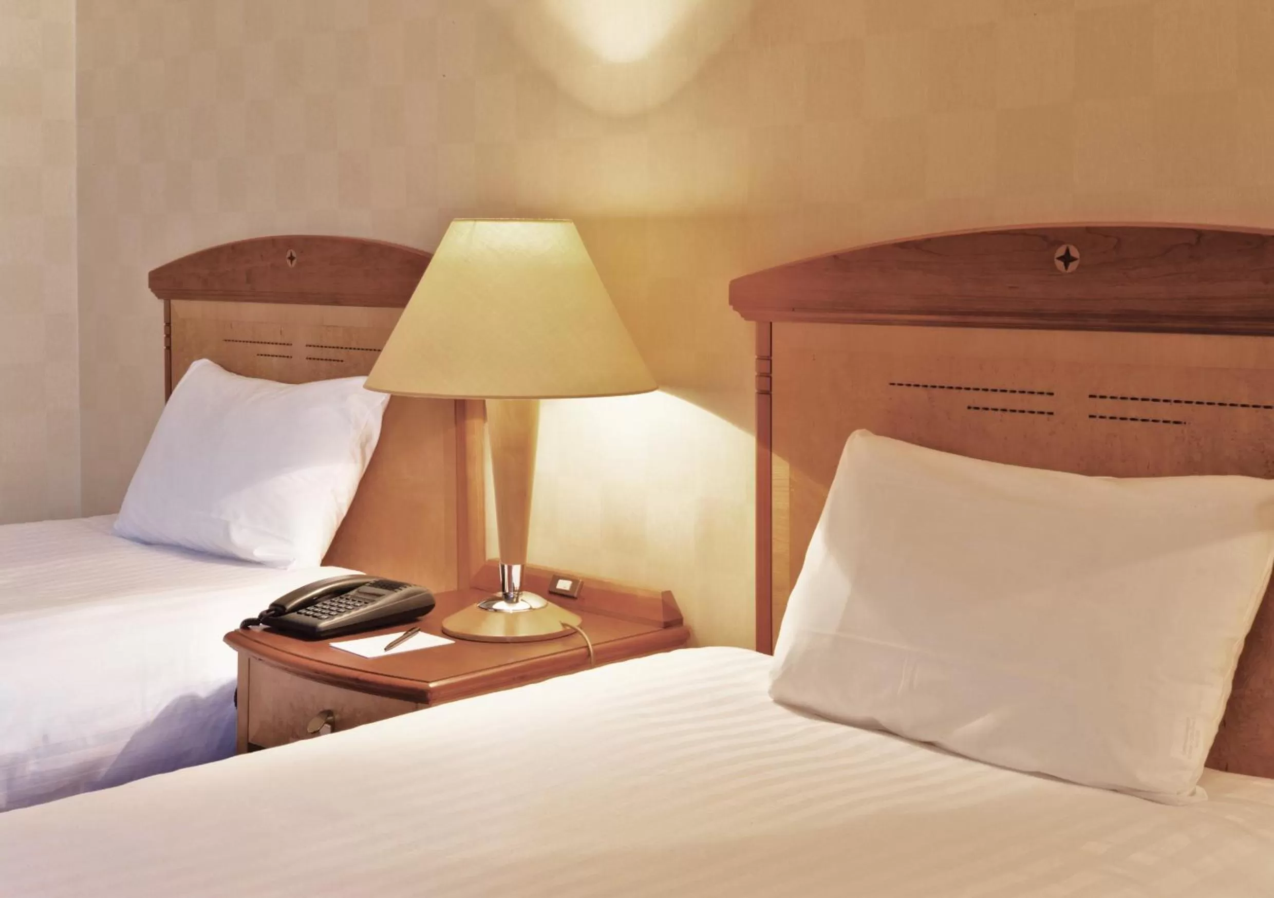 Bed in Millennium Hotel Paris Charles De Gaulle